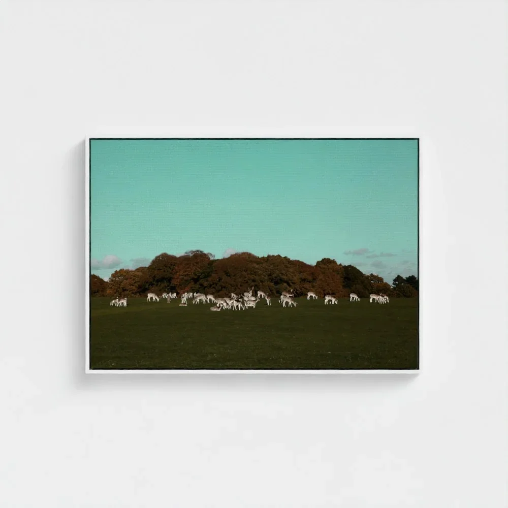 a-herd-of-deer-on-the-grassland- white-frame-canvas-28x40.webp