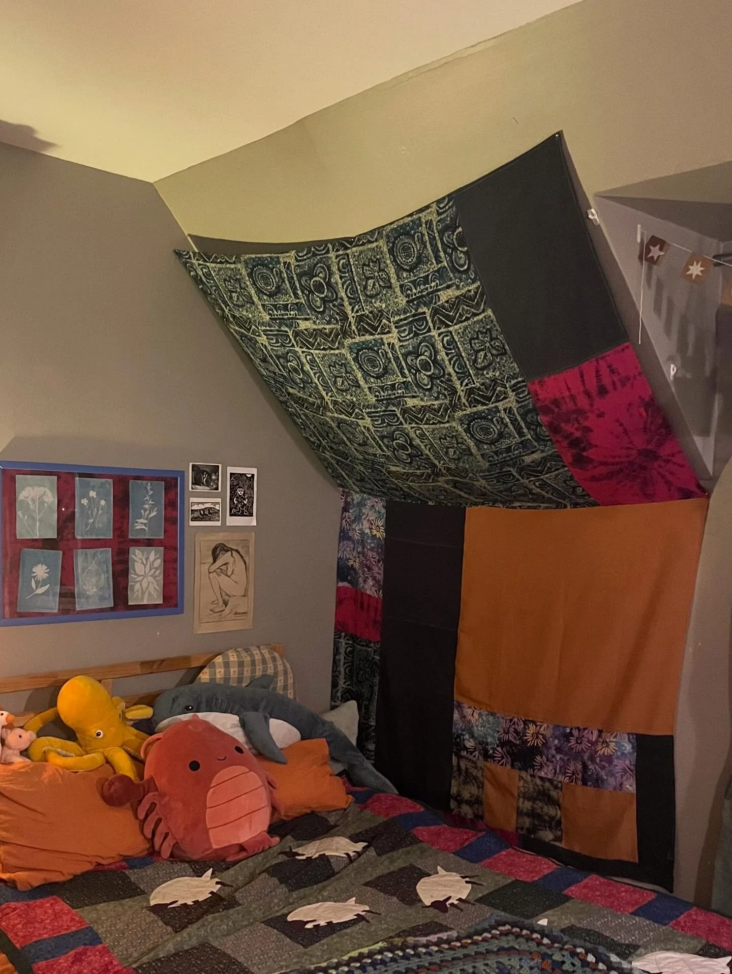 Big project!!!! For the last two days I worked on this big curtain/wall hanging/tapestry that I intended to cozify the slanted ceiling corner over my bed. I used a ton of scrap fabric from my stash, and the finished product ended up being around 8 by