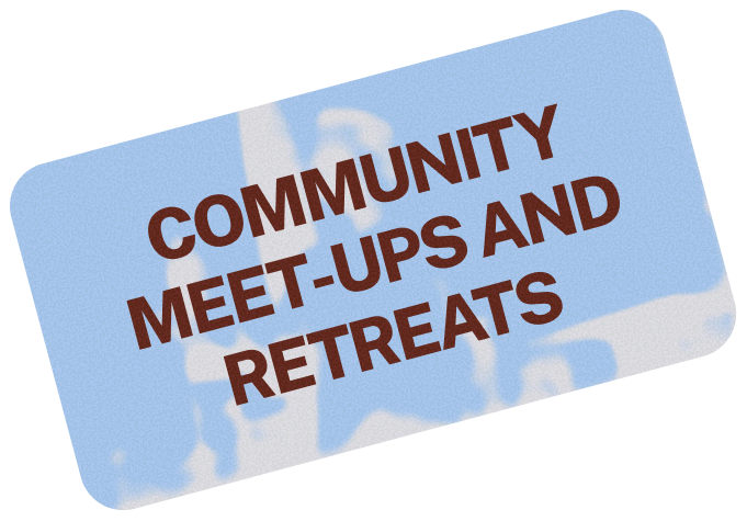 Sign that reads "Community Meet-Ups and Retreats" with a textured background.