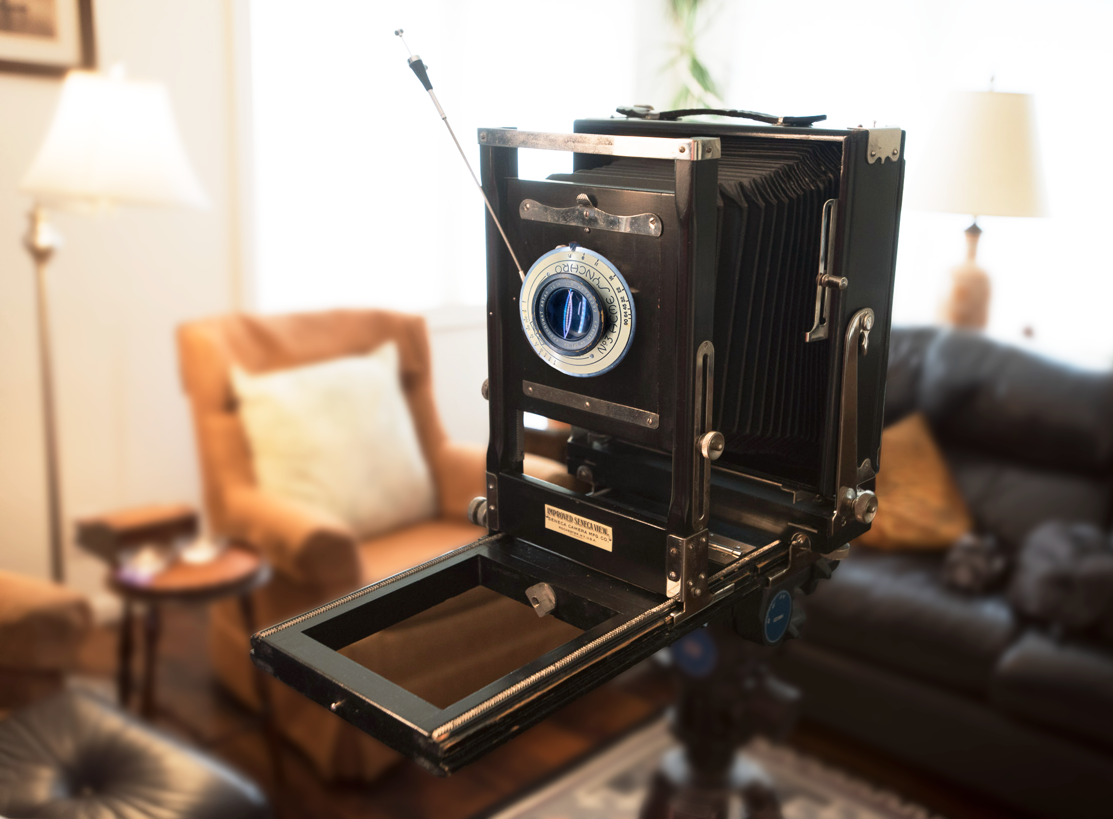 Kandrzej using a vintage 1906 Seneca view camera for a large format portrait commission in Colorado.