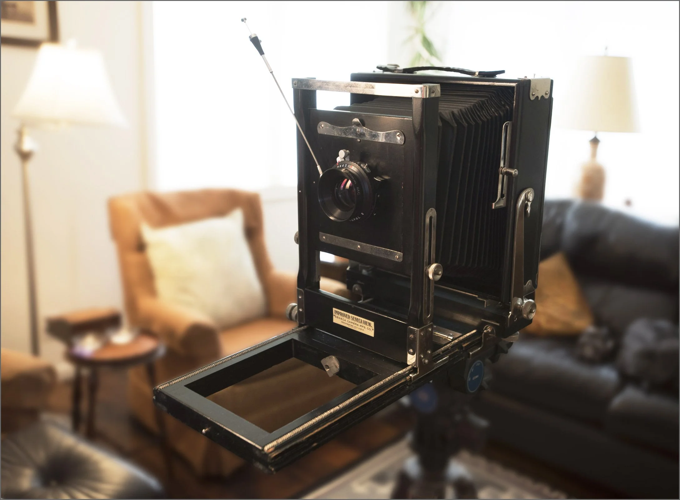 K. Andrzej using a vintage 1906 Seneca view camera for a large format portrait commission in Colorado.