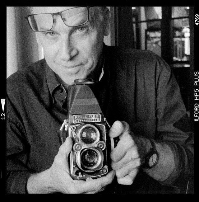 K. Andrzej with a Rolleiflex Camera.