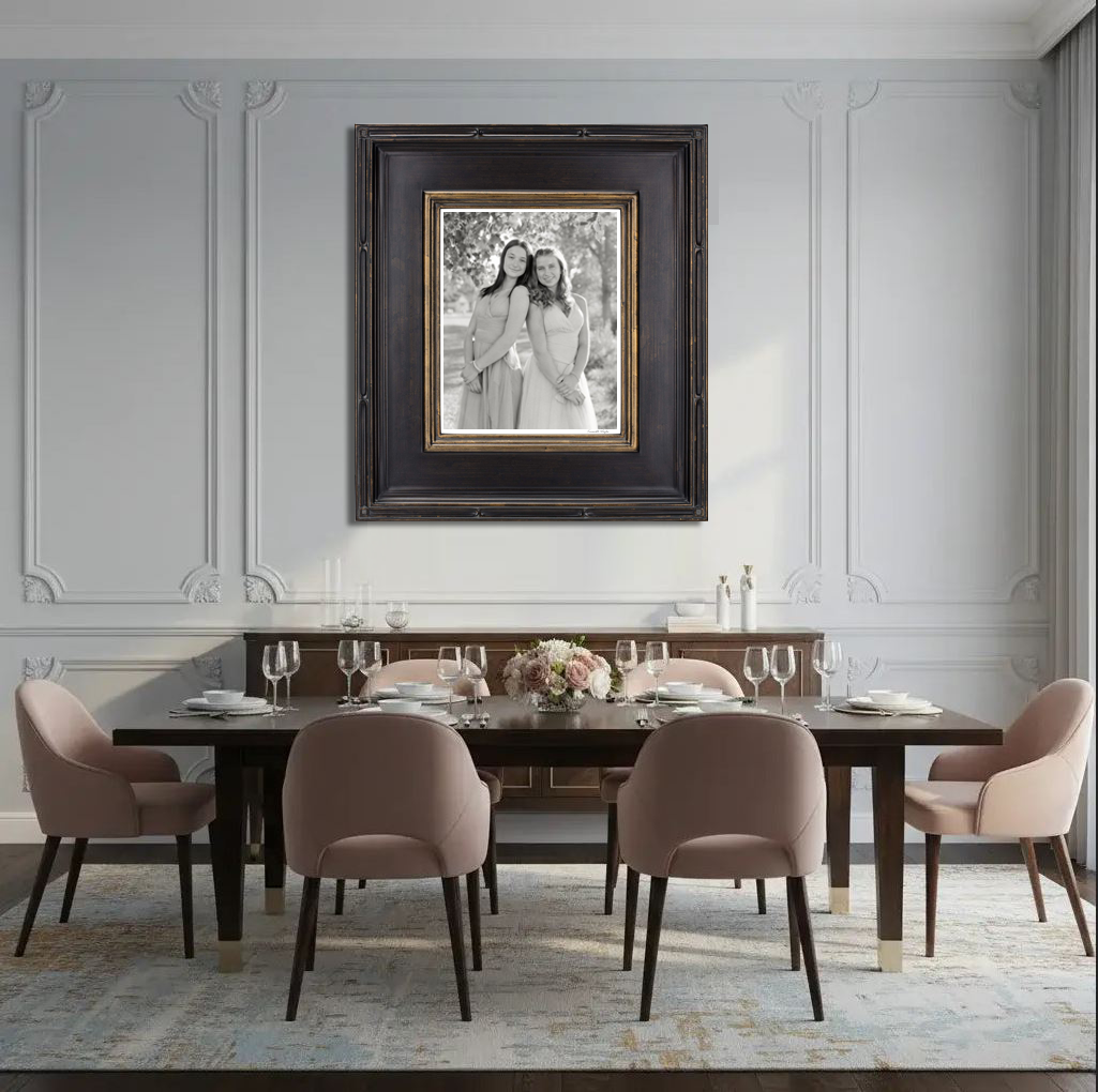Large format patriarchal portrait custom framed and installed above a formal dining table in a private estate.
