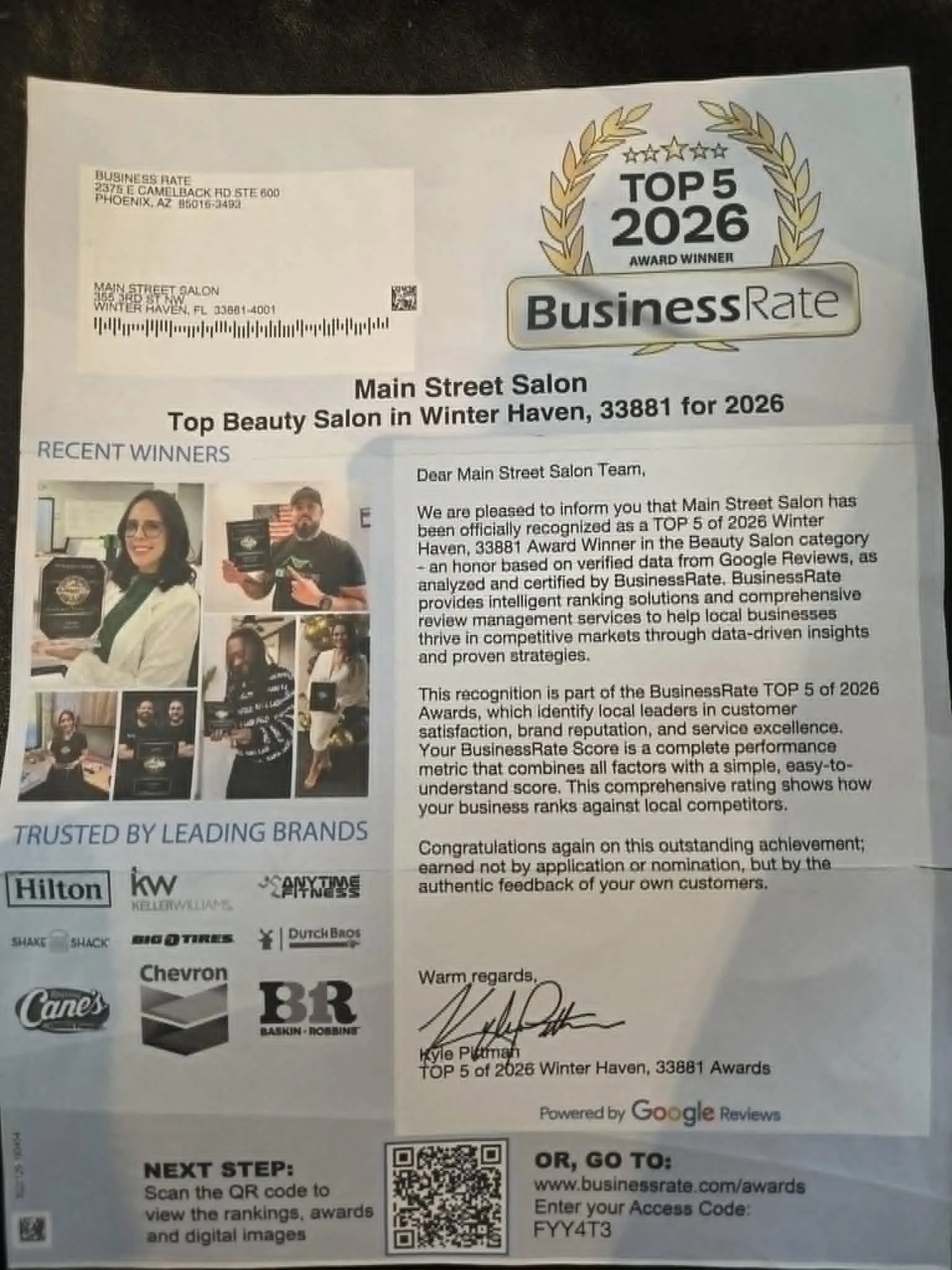 A letter announcing that Main Street Salon is a Top 5 Award Winner in Winter Haven, Florida, for 2026. The letter includes logos of sponsors, photos of people, and a QR code for more information.
