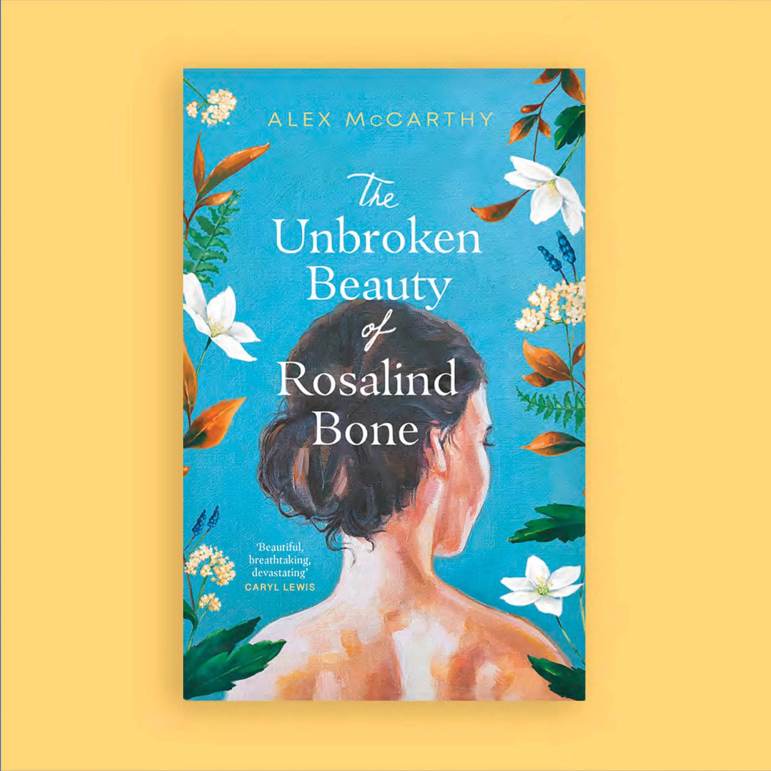 Book cover titled "The Unbroken Beauty of Rosalind" by Alex McCarthy, featuring a painted portrait of a woman with dark hair, surrounded by white flowers, green leaves, and orange-brown foliage against a blue background.