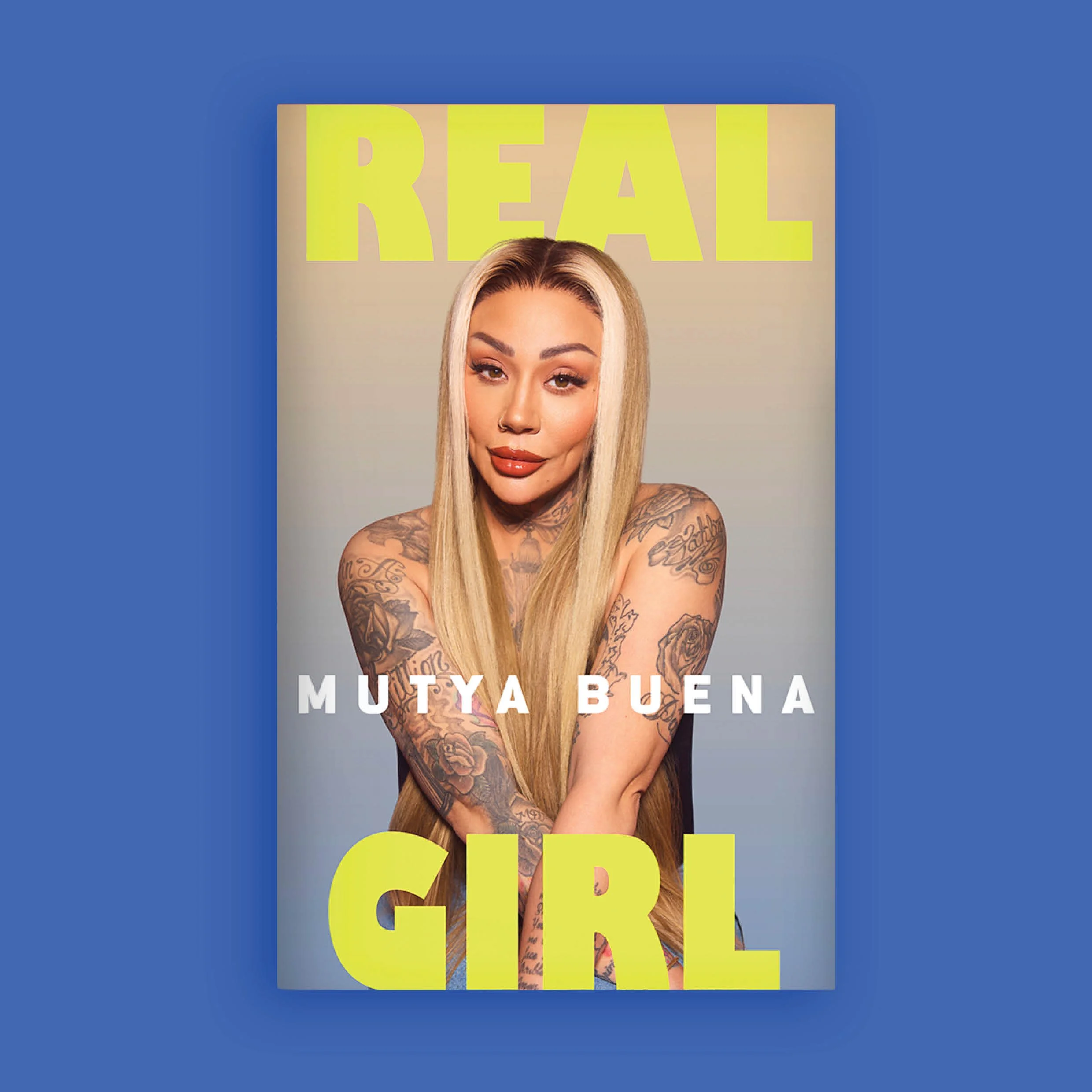 Book cover featuring Mutya Buena from Sugarbabes band , title 'REAL GIRL' in large yellow letters at the top and the author's name 'MUTYA BUENA' in white at the bottom.