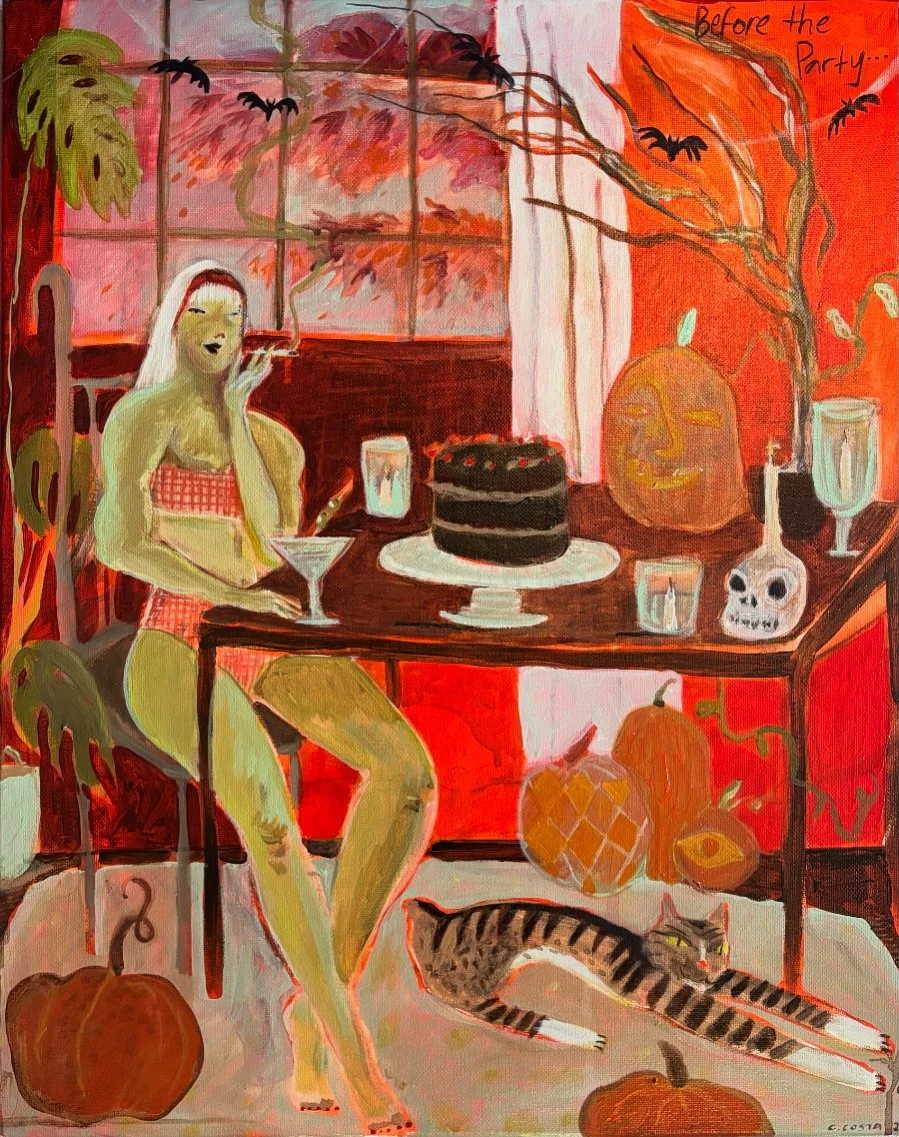 A woman in a red checkered bikini sitting at a table with Halloween decorations, a cake, and drinks, with a cat stretching on the floor and pumpkins around the room, in a warm, autumn-themed setting with orange, red, and brown tones.