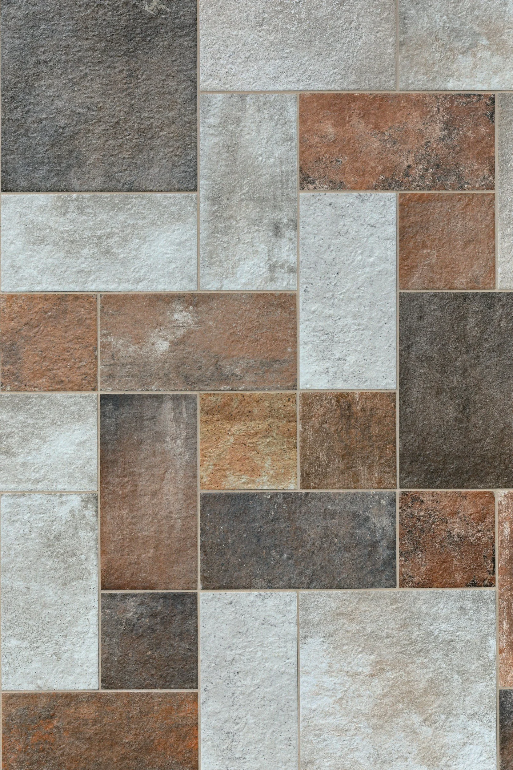 A collage of multiple rectangular tiles with textured surfaces in various earth tones including shades of gray, beige, brown, and rust.