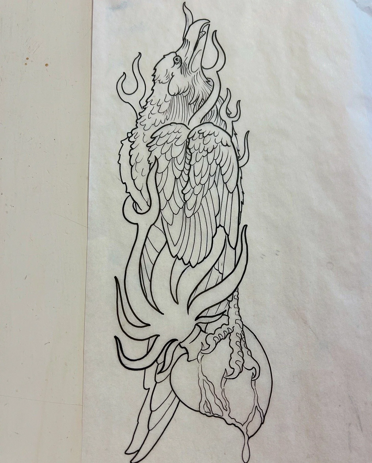 Black and white line drawing of a phoenix with flames and fire elements around it.