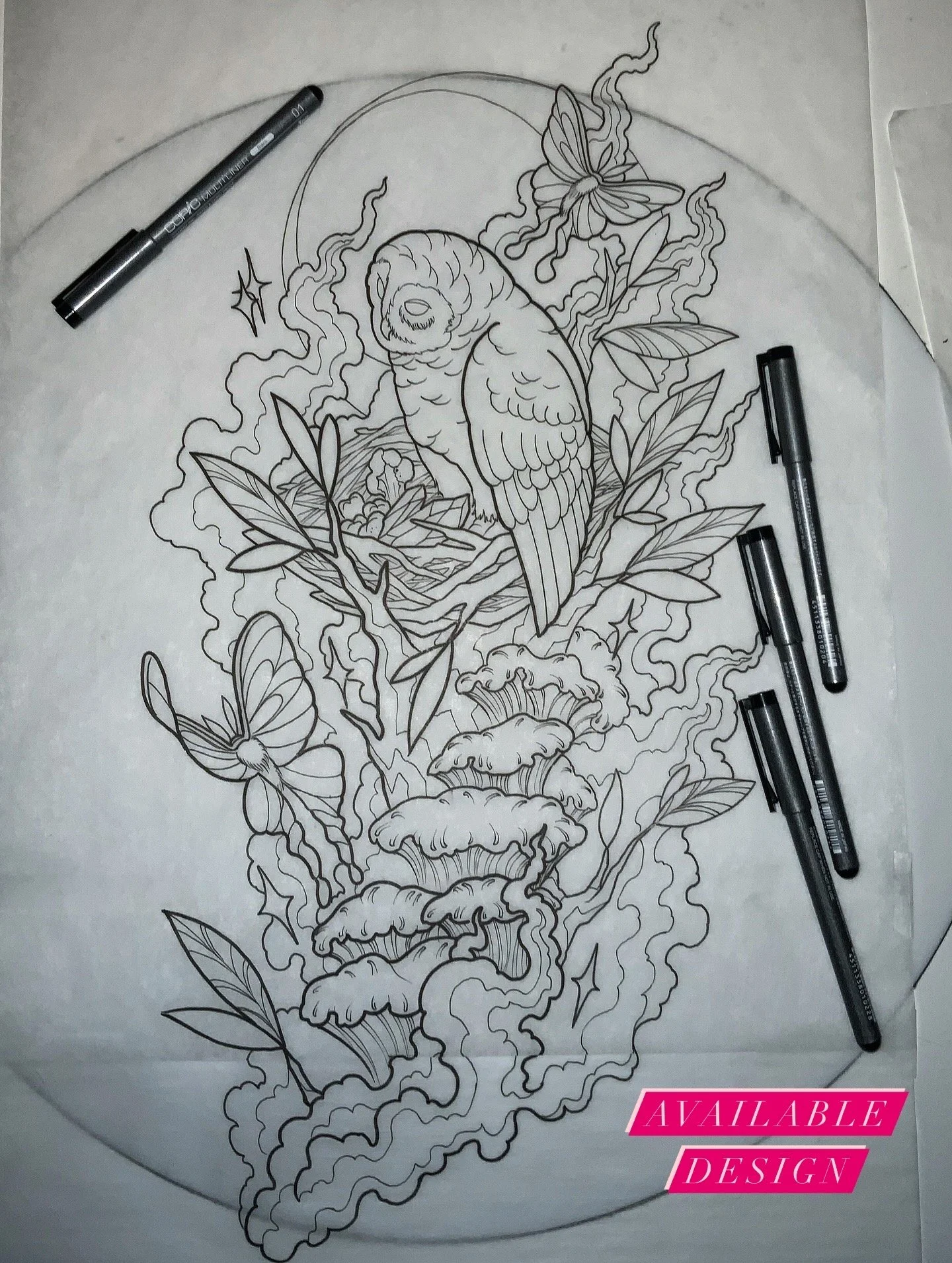 Black and white line drawing of a bird, butterflies, and flowers with smoke or steam-like patterns in the background on a sheet of paper, with pens nearby.