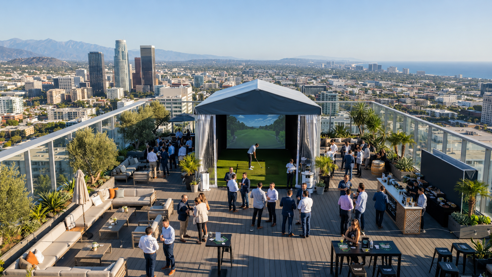 Rooftop outdoor party with people socializing, a golf simulator, and city skyline view.