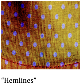 Close-up of yellow fabric with purple polka dots and red stitching.