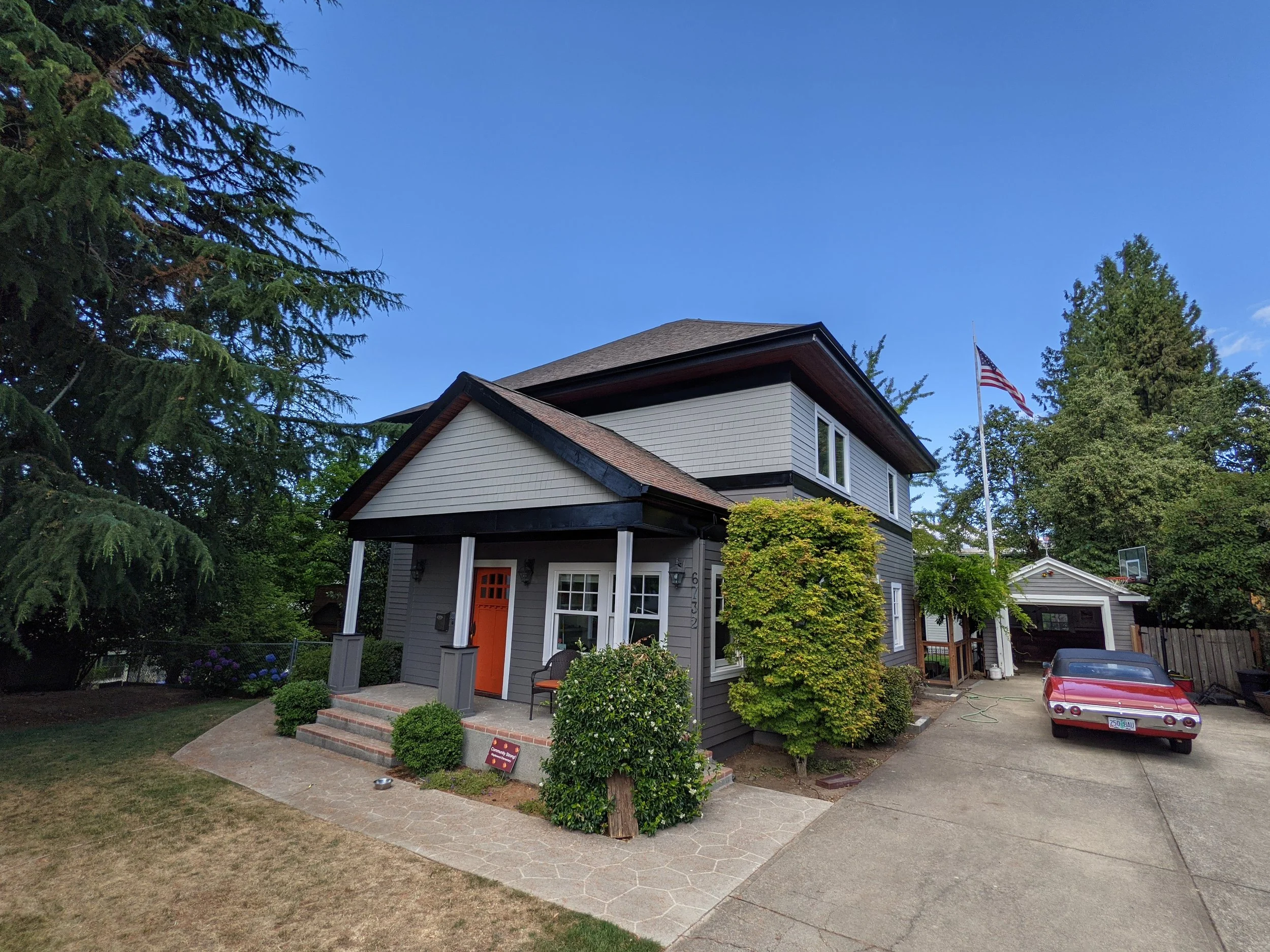 image of a two story house with a bold paint job and a picturesque vibe