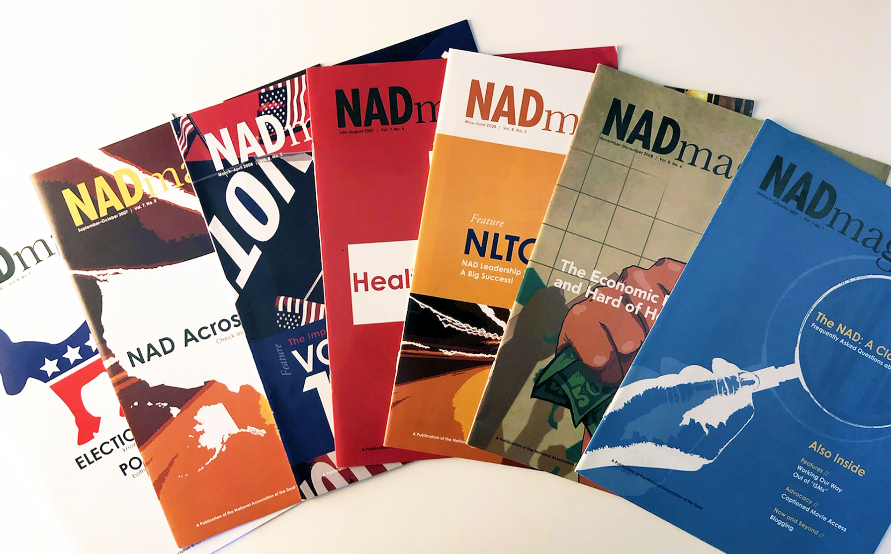 A fanned-out display of colorful NADmag magazine covers, showing several of the twelve print issues