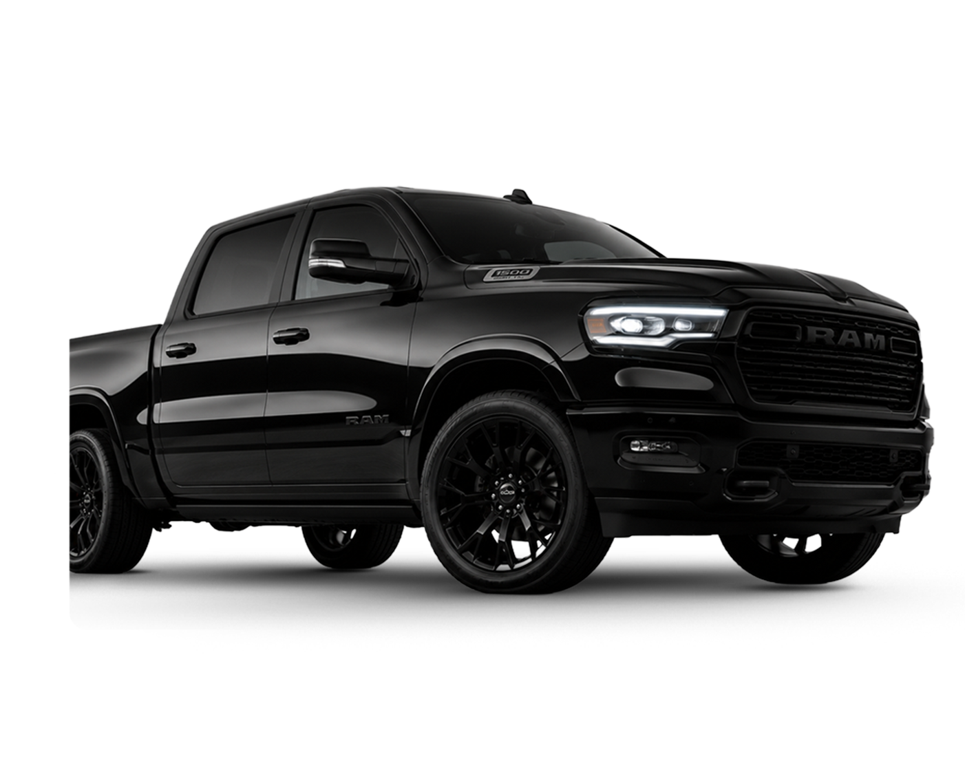 Black RAM pickup truck with tinted windows, black wheels, and a sleek design, viewed from the front left side.