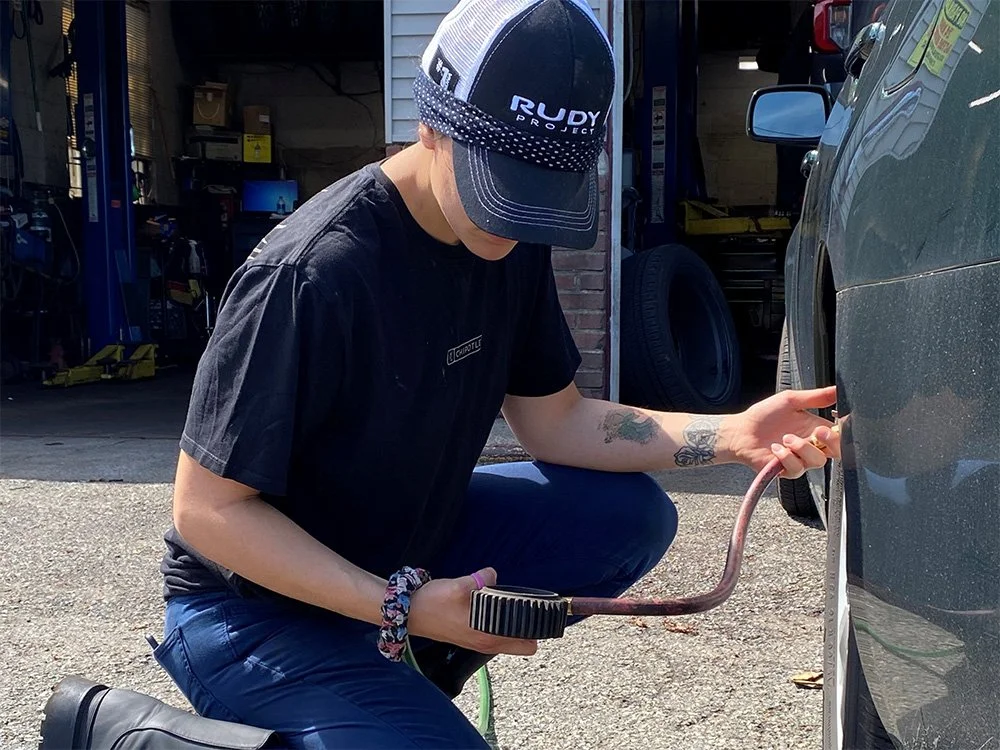 Mechanic testing air pressure