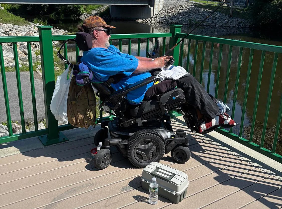 Individual enjoying a structured day program fishing trip