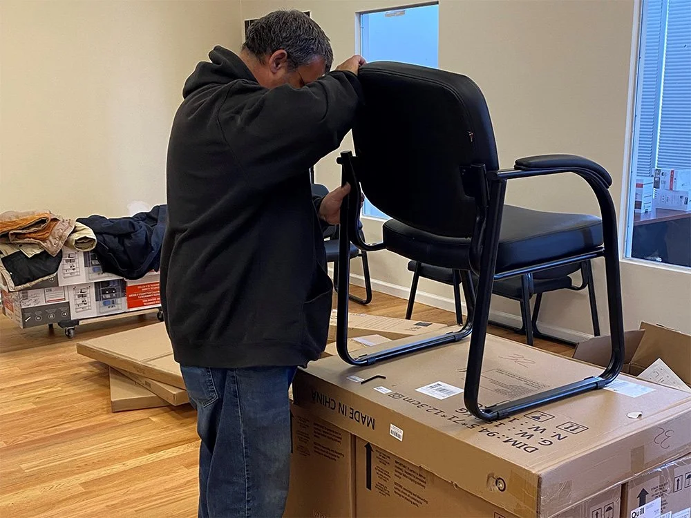 Individual putting together a new chair