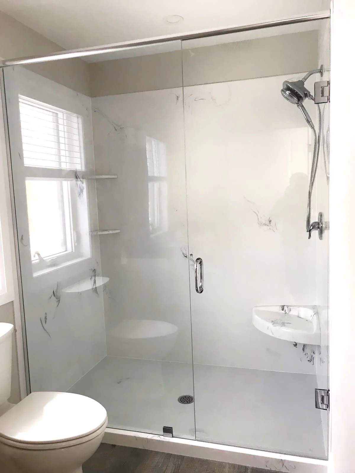 Custom bathroom renovation with cultured marble shower
