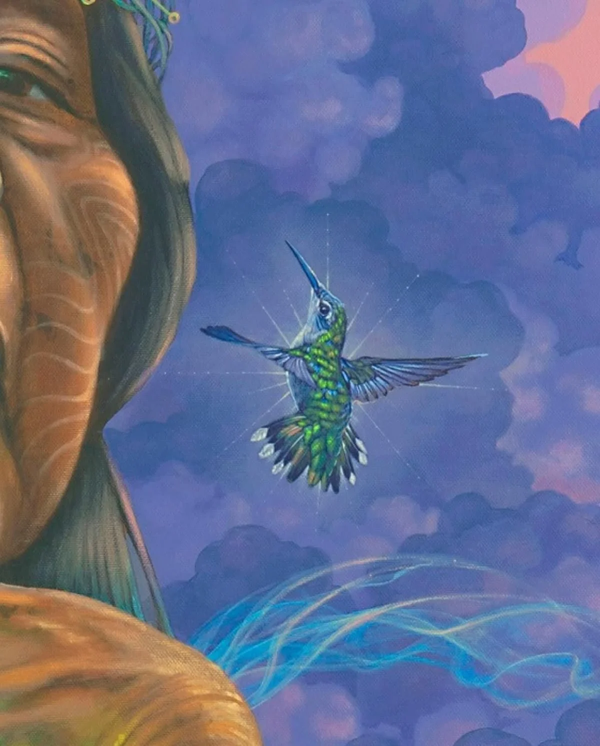 A detailed painting of a hummingbird with iridescent green and blue feathers flying near a large fish head, set against a background of purple and pink clouds with swirling blue lines.