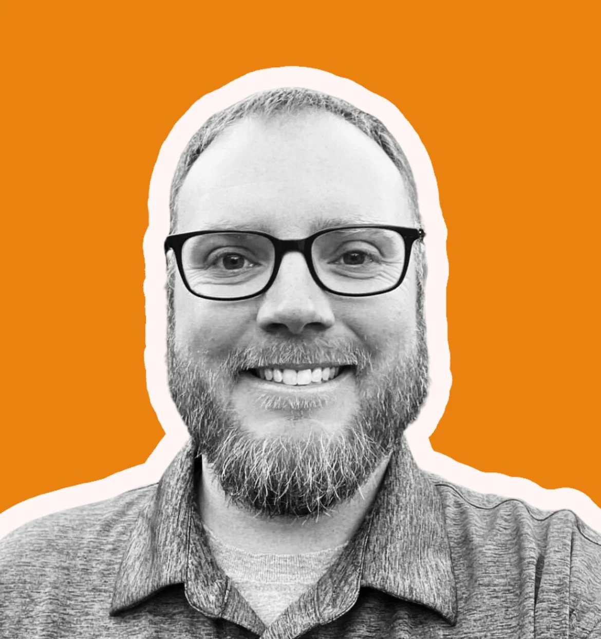 Black and white photo of a smiling man with glasses and a beard, with an orange background and white outline around his face.