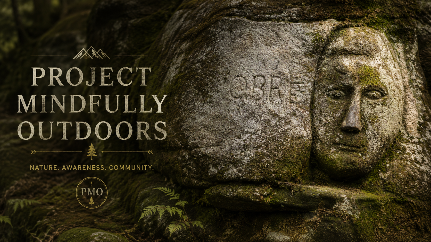 A moss-covered stone monument showing a carved human face with the text 'Project Mindfully Outdoors' and the words 'Nature. Awareness. Community.' on the left side.