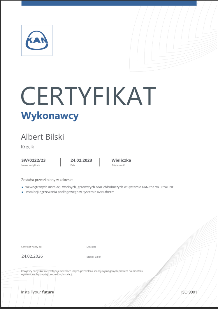A certificate written in Polish, awarded to Albert Bilski for training in water, heating, and cooling system installations, issued on February 24, 2023, in Wieliczka, valid until February 24, 2026, signed by Maciej Cisek, with the KAN logo at the top