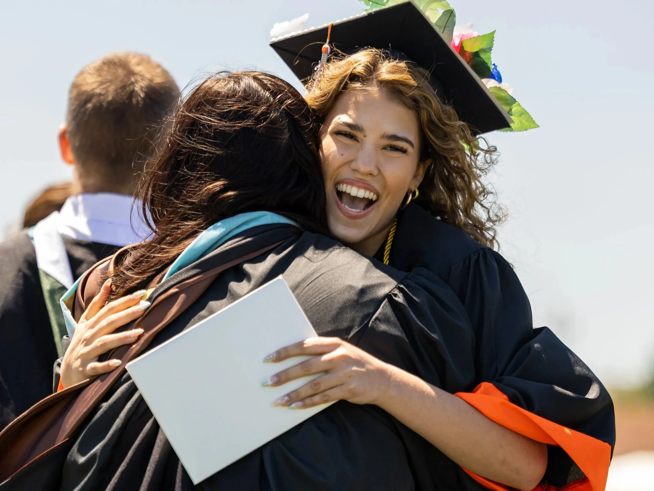 92+%E2%80%94+Graduation+long+lens-596%2C+graduation+hug.jpg