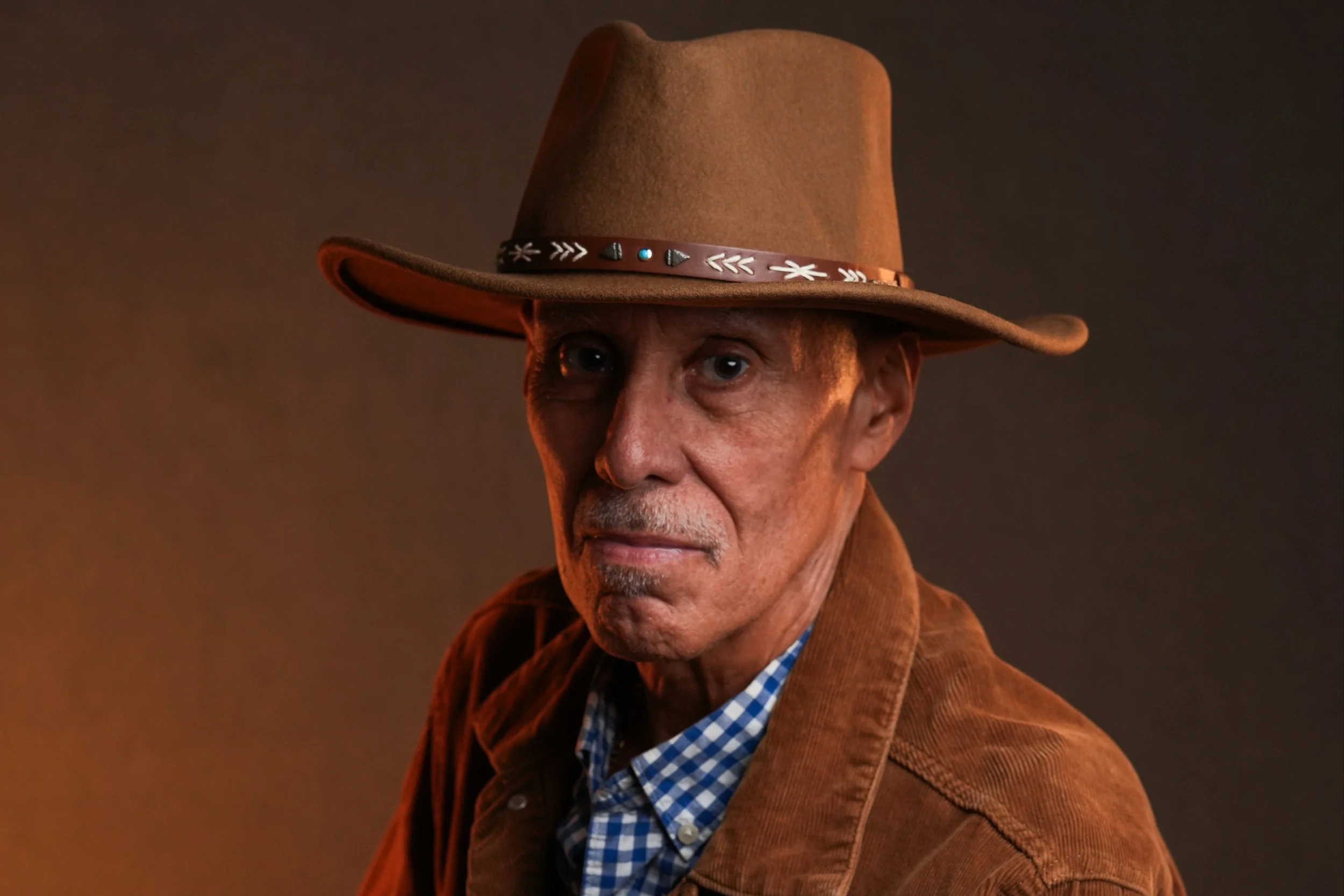 Paul Rivera, pulmonary fibrosis and lung transplant survivor, close up portrait in cowboy hat