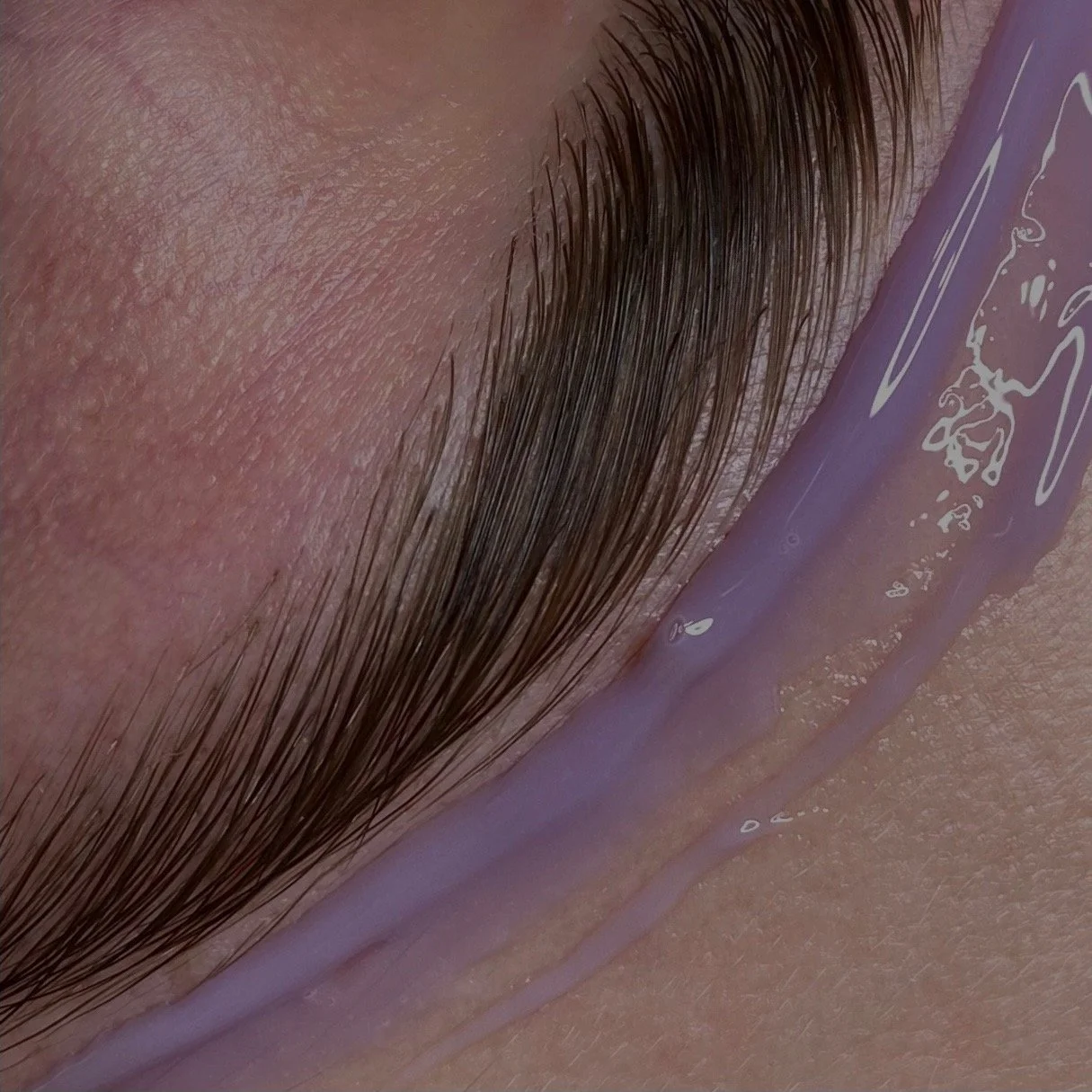 Close-up of brow wax service showing close attention to detail and shaping for a beautiful clean result