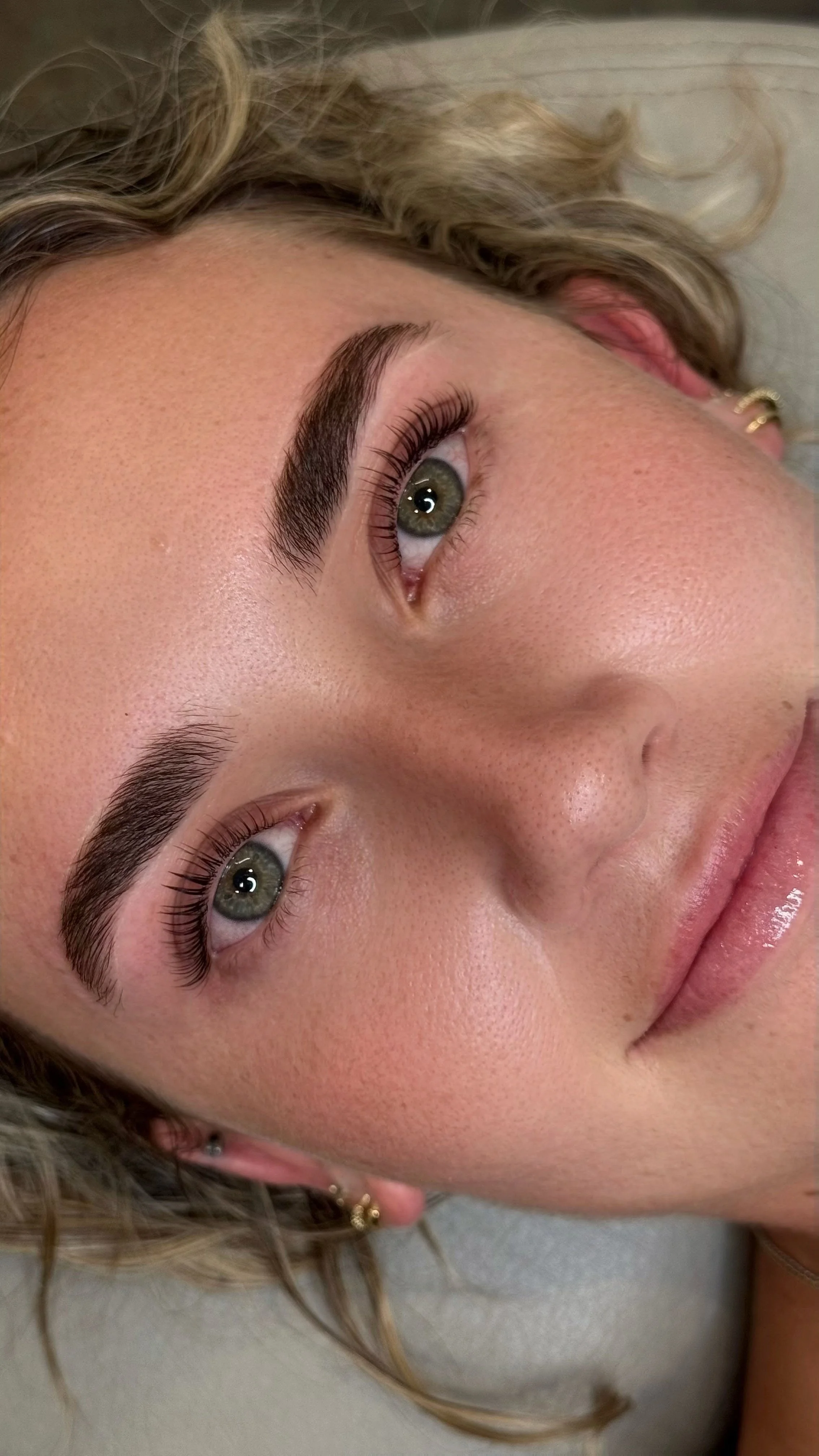 Client after receiving a professional brow lamination treatment at Melt West