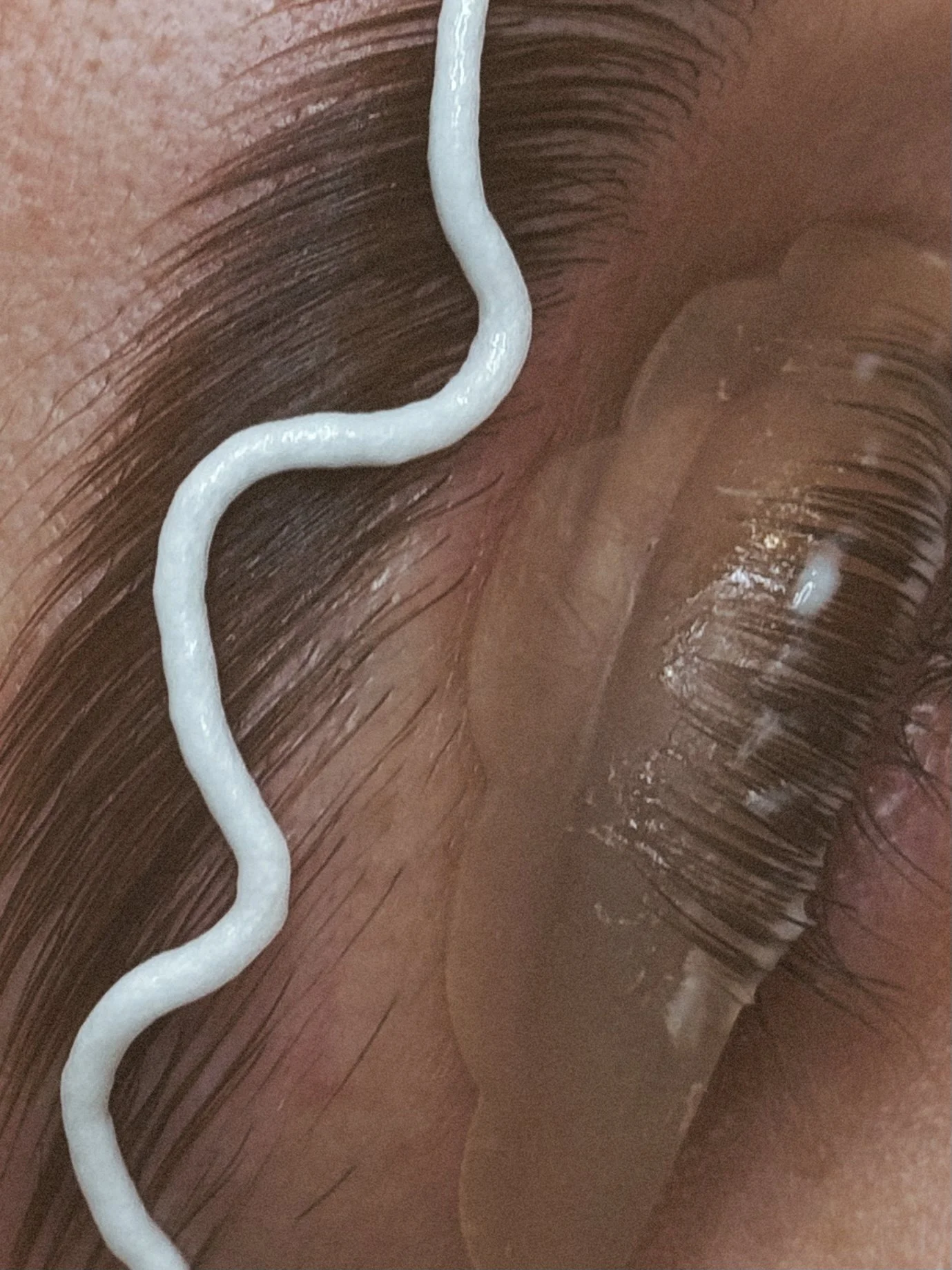 Close-up during a combo lash lift and brow lamination service at Melt West