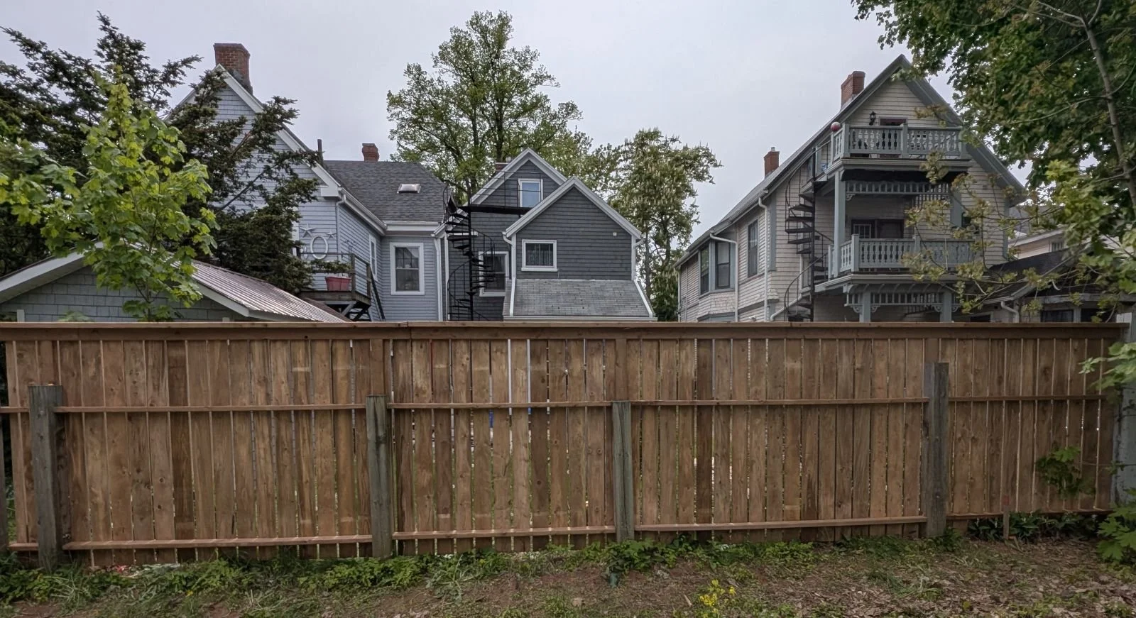 Custom pressure-treated wooden fence built in Charlottetown, PEI