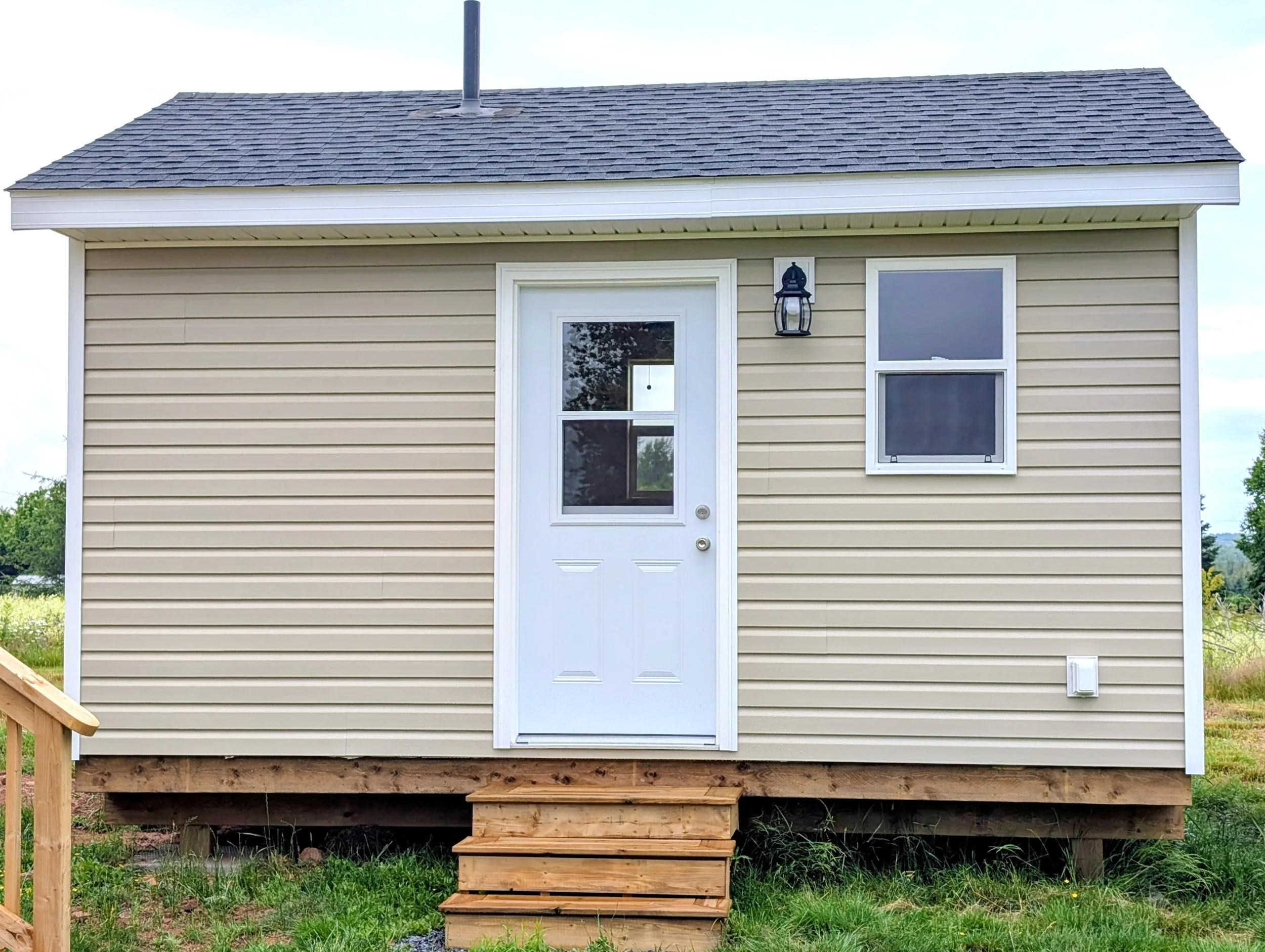 Custom built 12x16 bunk house with 1/2 bath and pine finish inside built for a cottage owner in Canoe Cove, PEI.
