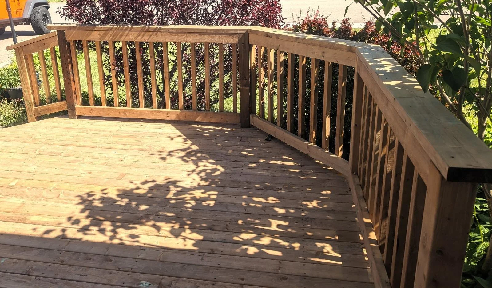 Custom designed and built pressure treated wood railings on deck for homeowner in Charlottetown, PEI.