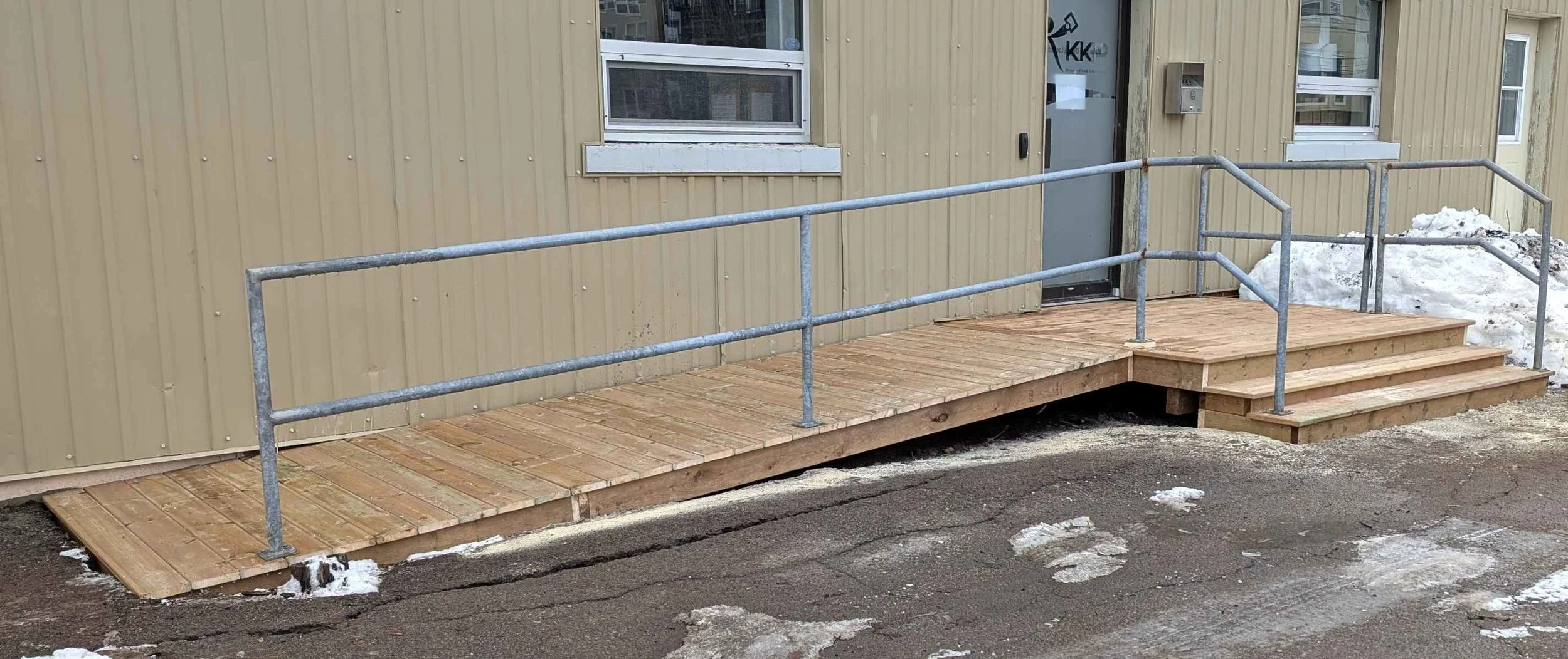 Custom design and built, pressure treated wooden landing and step, built for commercial business in Charlottetown, PEI