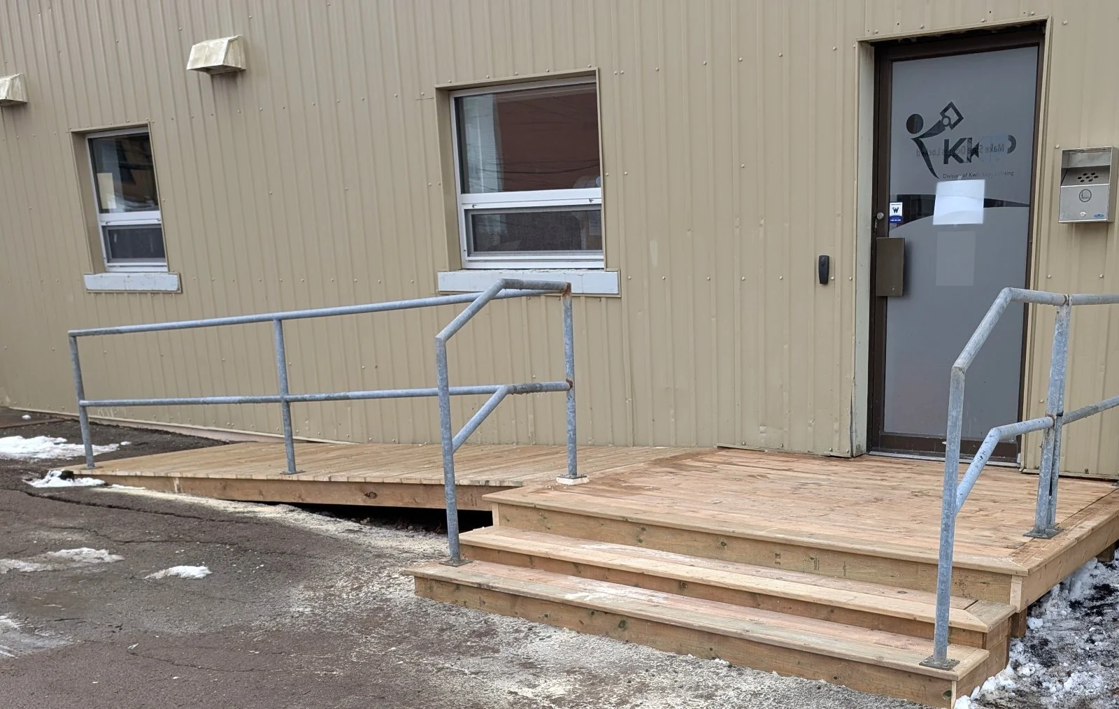 Custom design and built, pressure treated wooden landing and step, built for commercial business in Charlottetown, PEI