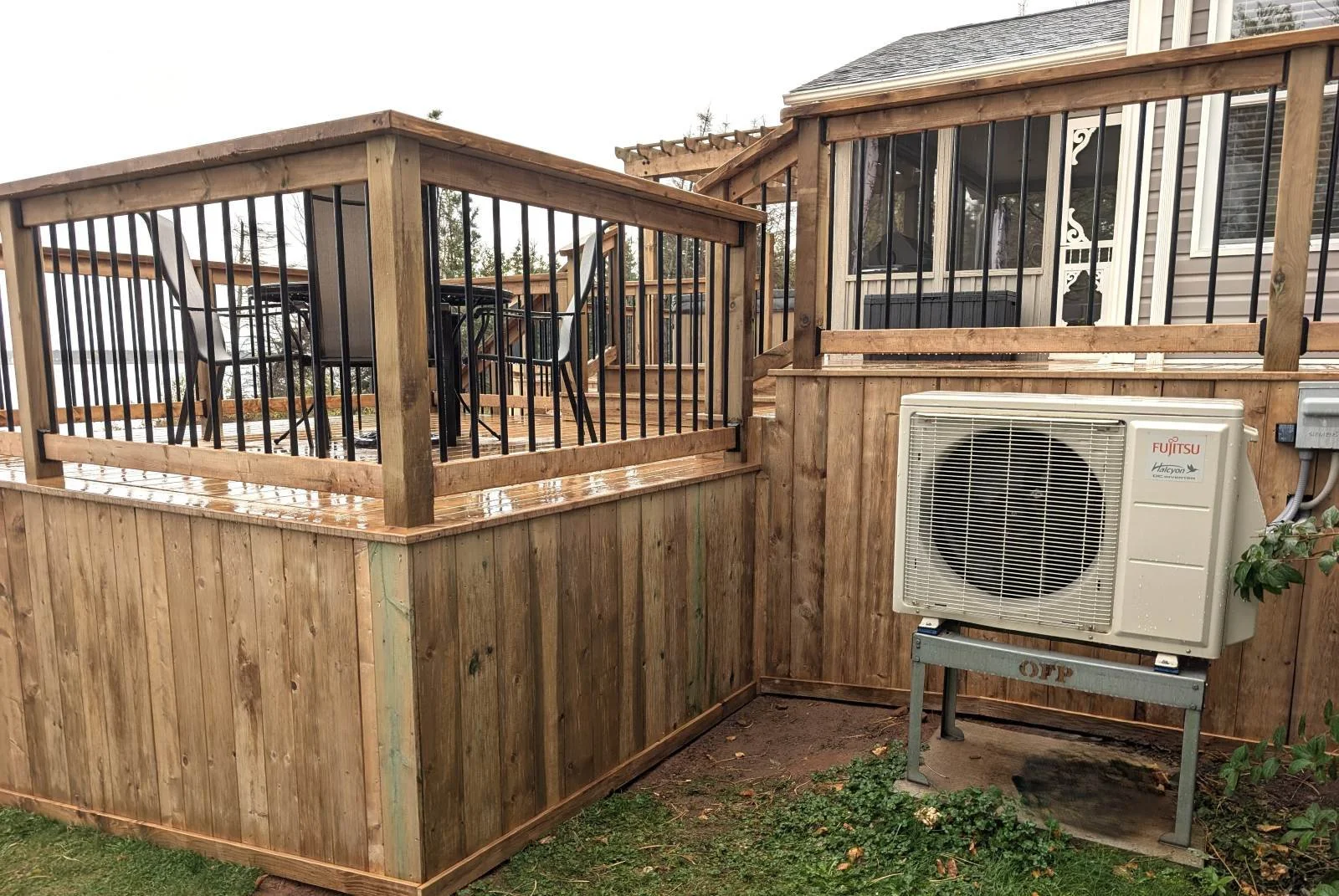 Custom built, pressure treated wood multi-level deck with dining area overlooking the water,  built for a home owner in West Covehead, PEI