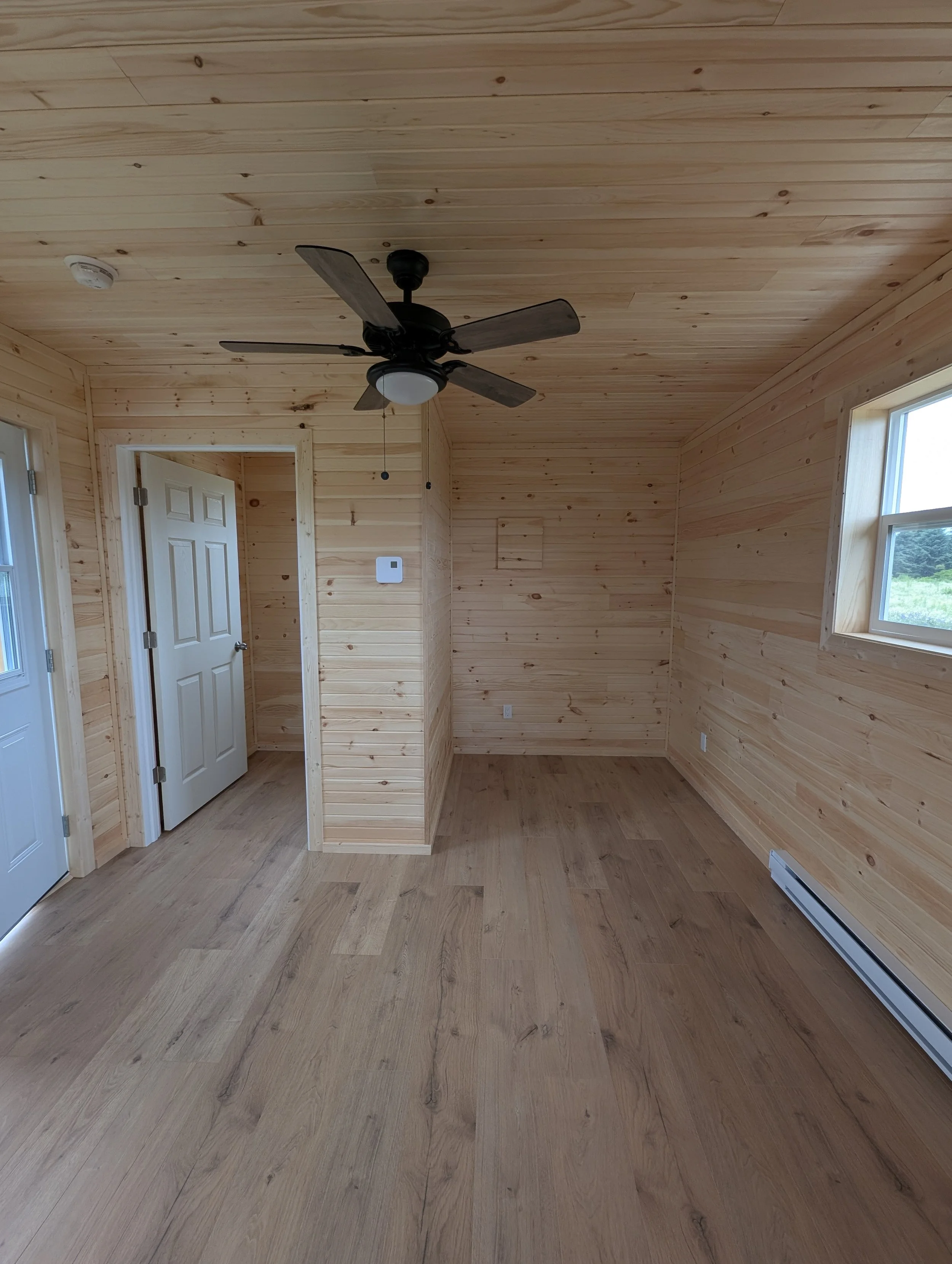 Custom designed and built 12 x 16 Bunk House with pine interior built for cottage owner in Canoe Cove, PEI.