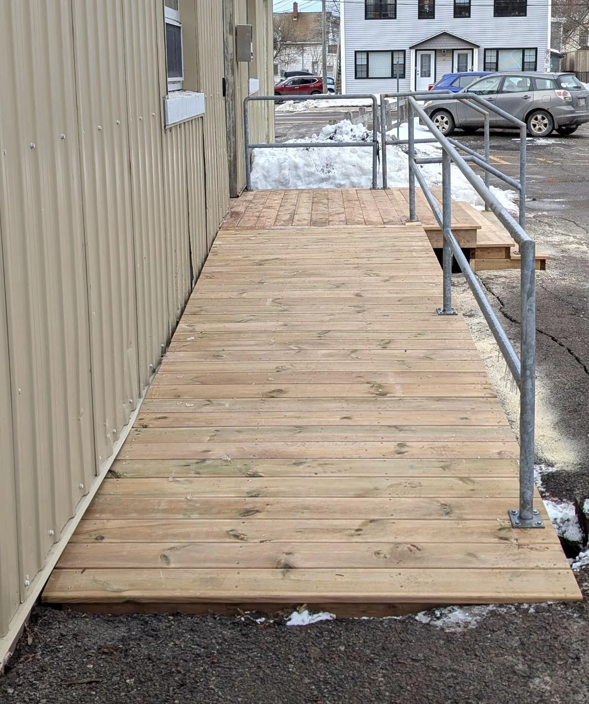 Custom design and built, pressure treated wooden landing and step, built for commercial business in Charlottetown, PEI