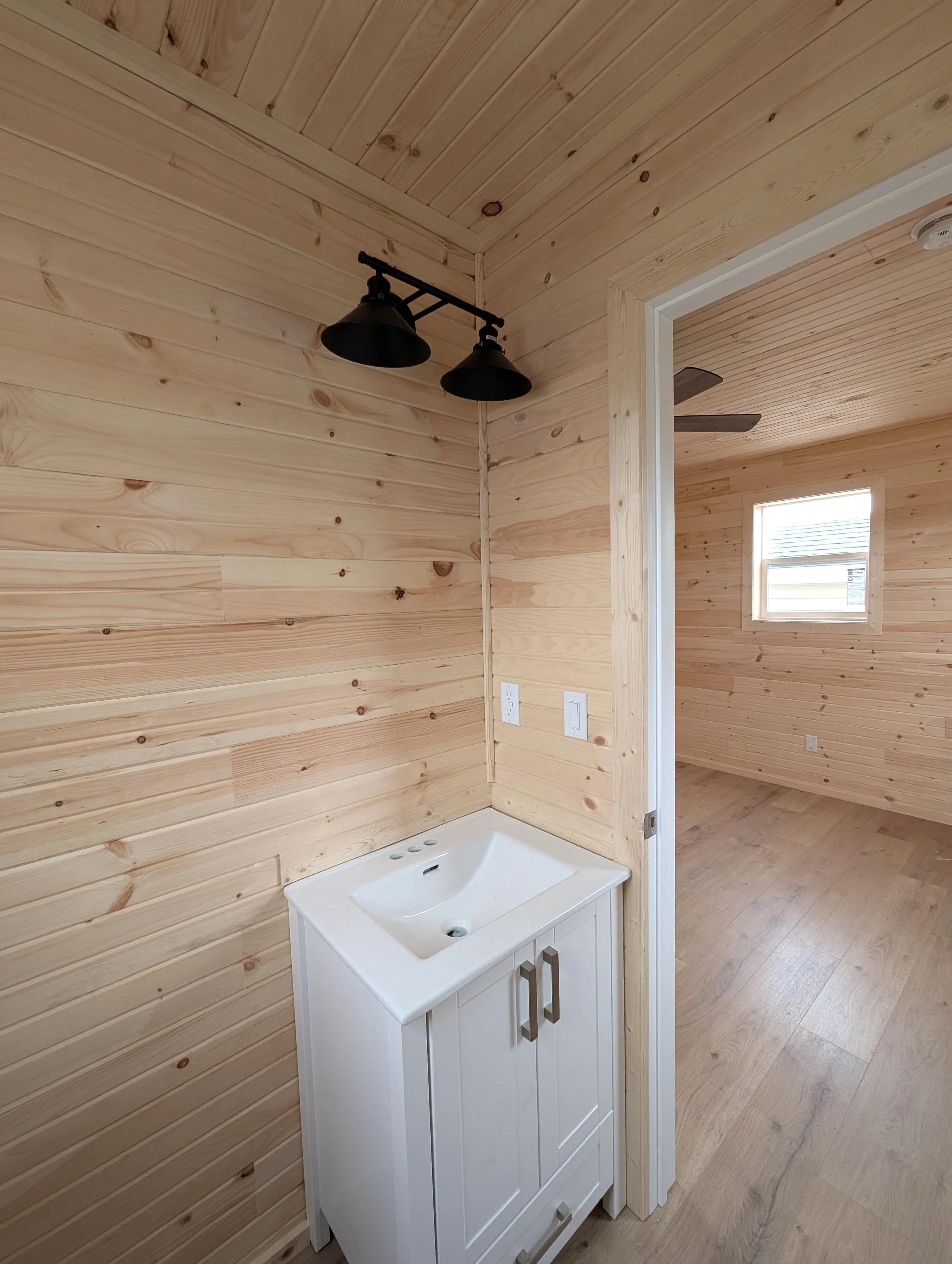 Custom designed and built 12 x 16 Bunk House with pine interior and half bath built for cottage owner in Canoe Cove, PEI.