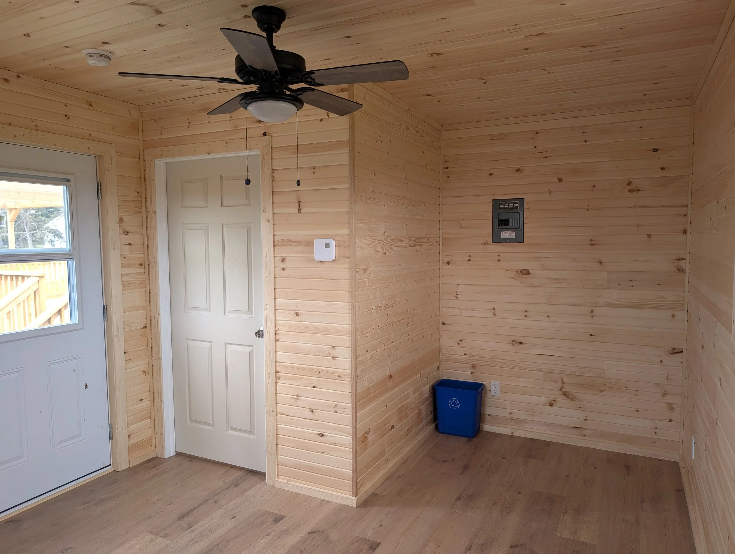 Custom designed and built 12 x 16 Bunk House with pine interior built for cottage owner in Canoe Cove, PEI.
