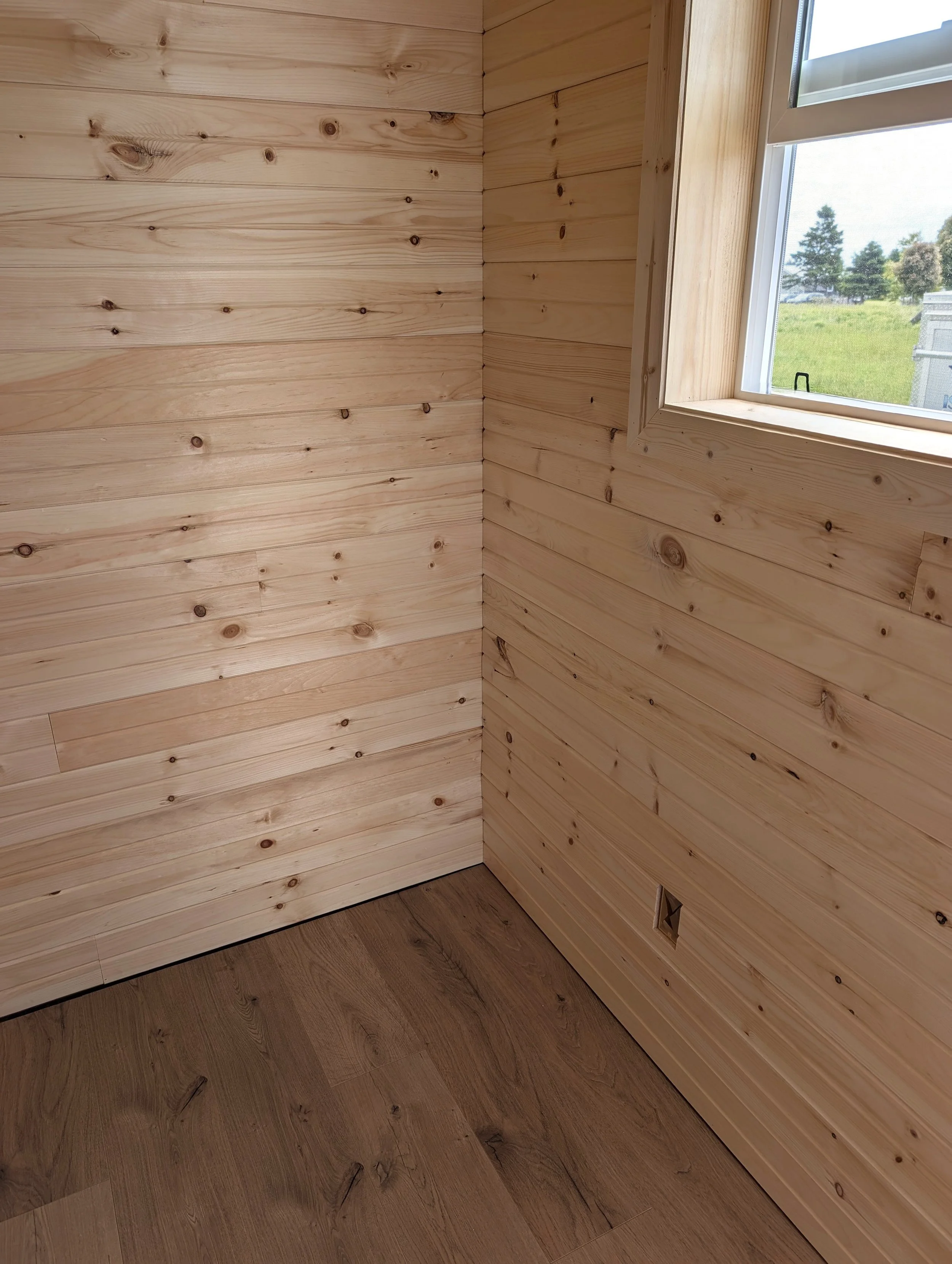 Custom designed and built 12 x 16 Bunk House with pine interior built for cottage owner in Canoe Cove, PEI.