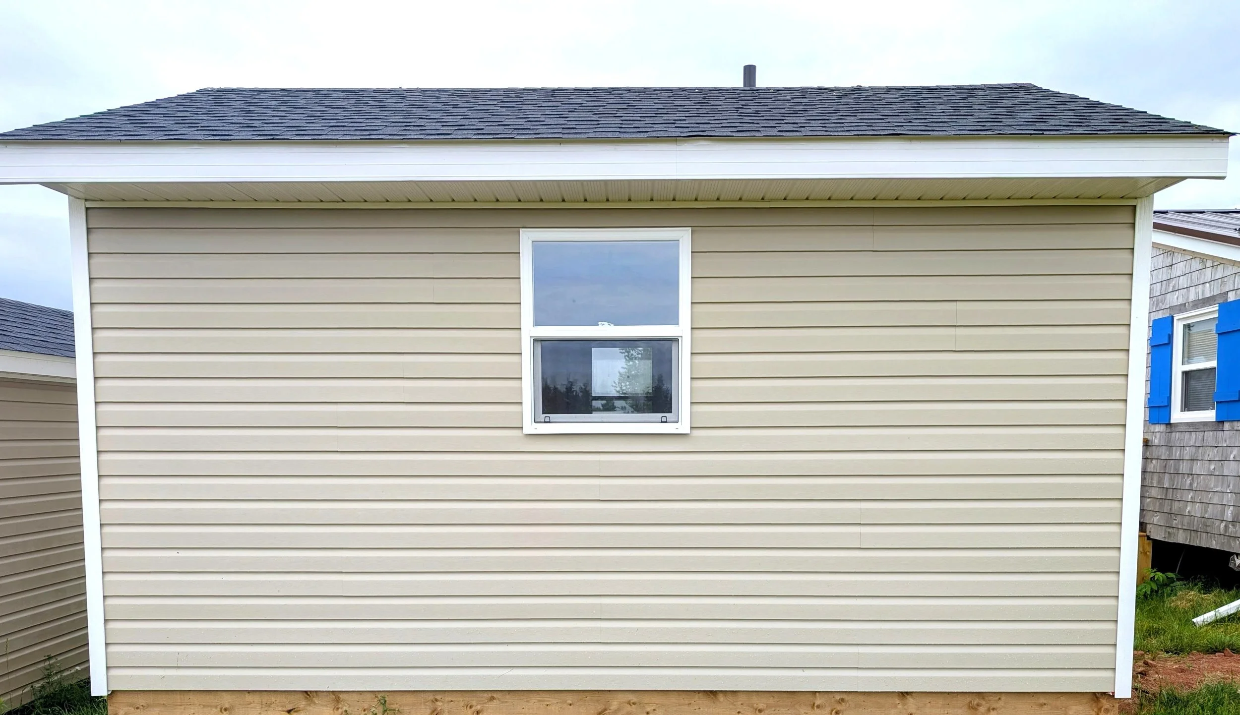 Custom designed and built detached 12 x 16 Bunk House with vinyl siding built for cottage owner in Canoe Cove, PEI.