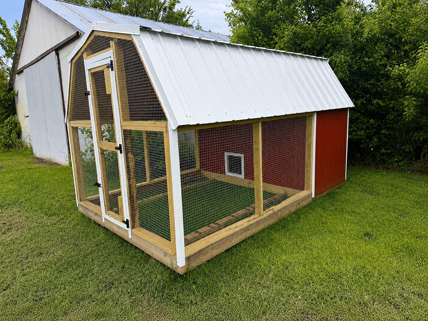 Side view of a red chicken coop portable building in Council Hill, OK