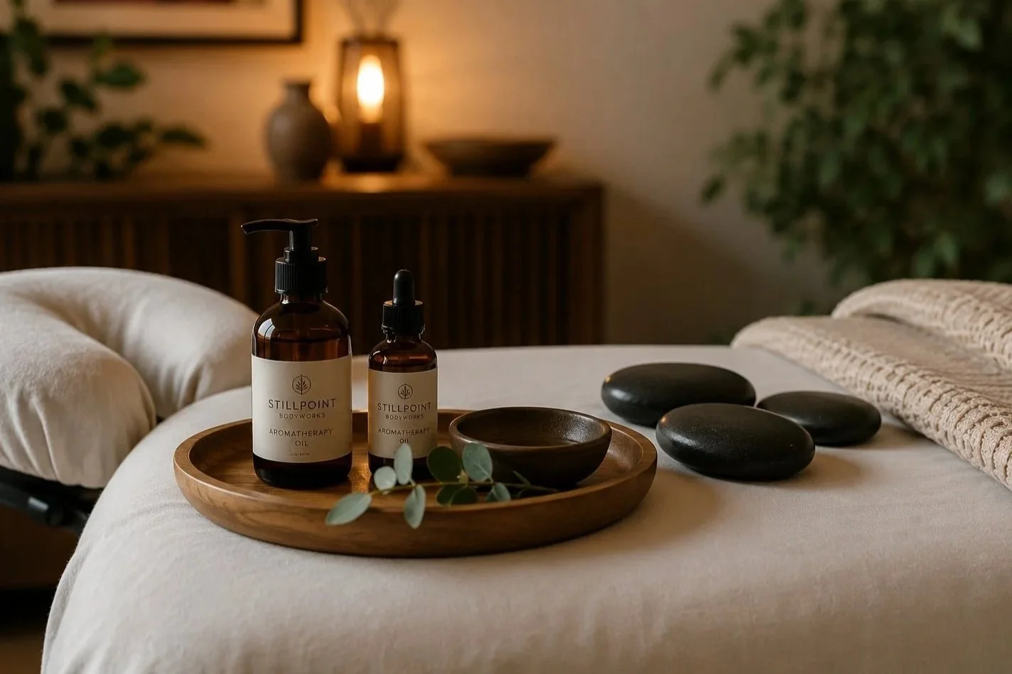 Oils, stones, and towels photo: Massage therapy tools and treatment supplies