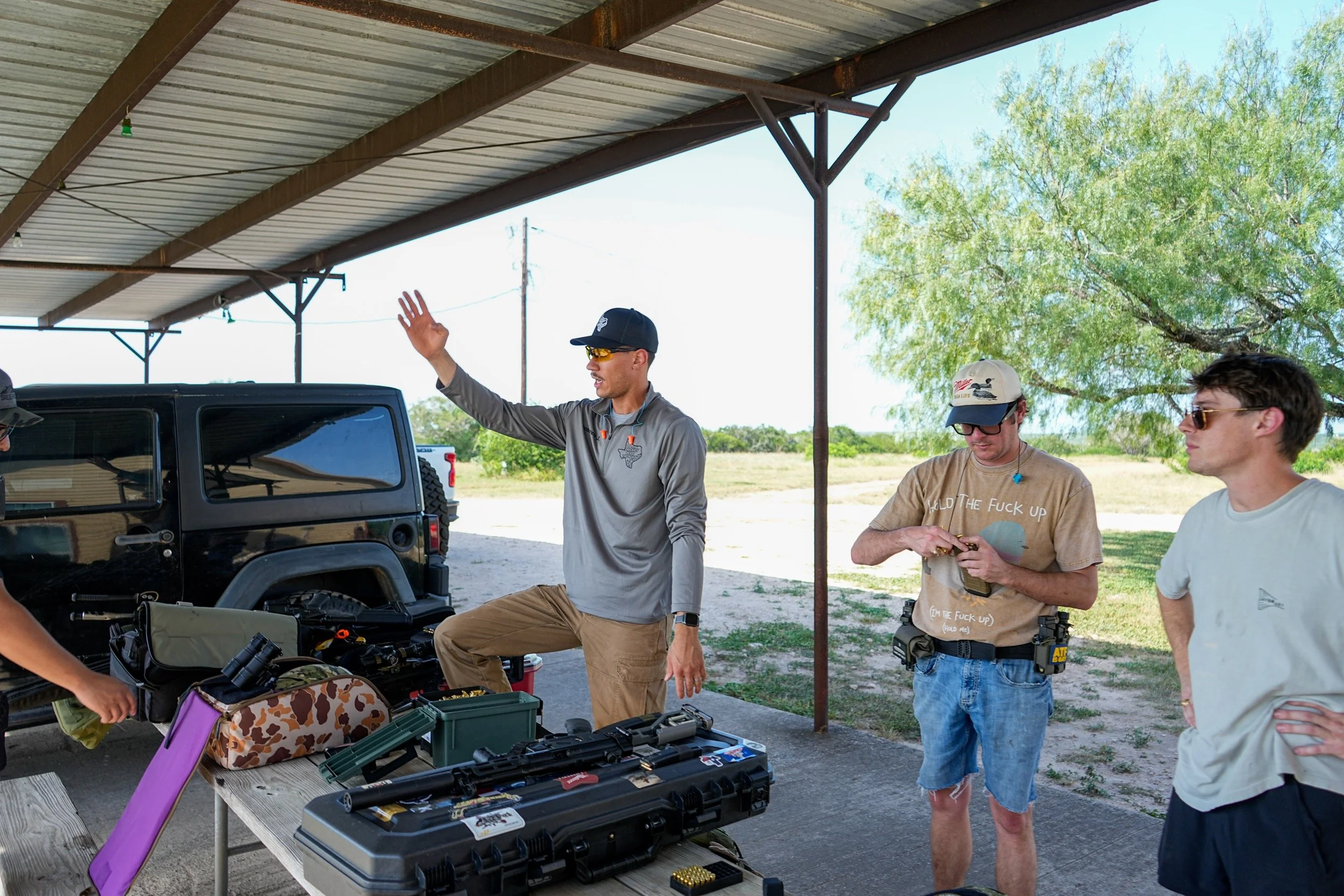 Guests shooting rifles on a private range at Thermal Ranch in South Texas.