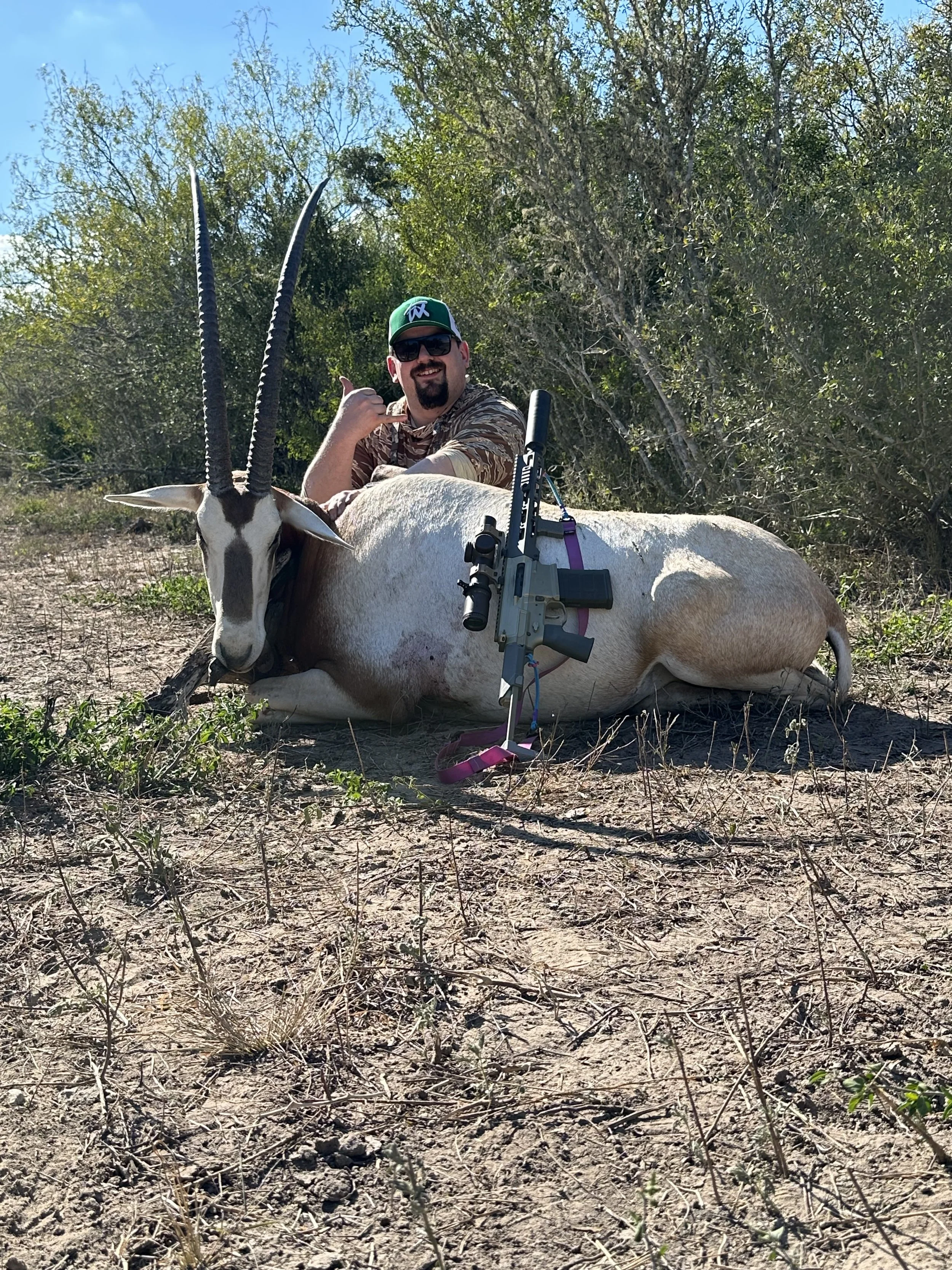 Hunter with a trophy scimitar-horned oryx at Thermal Ranch in South Texas.