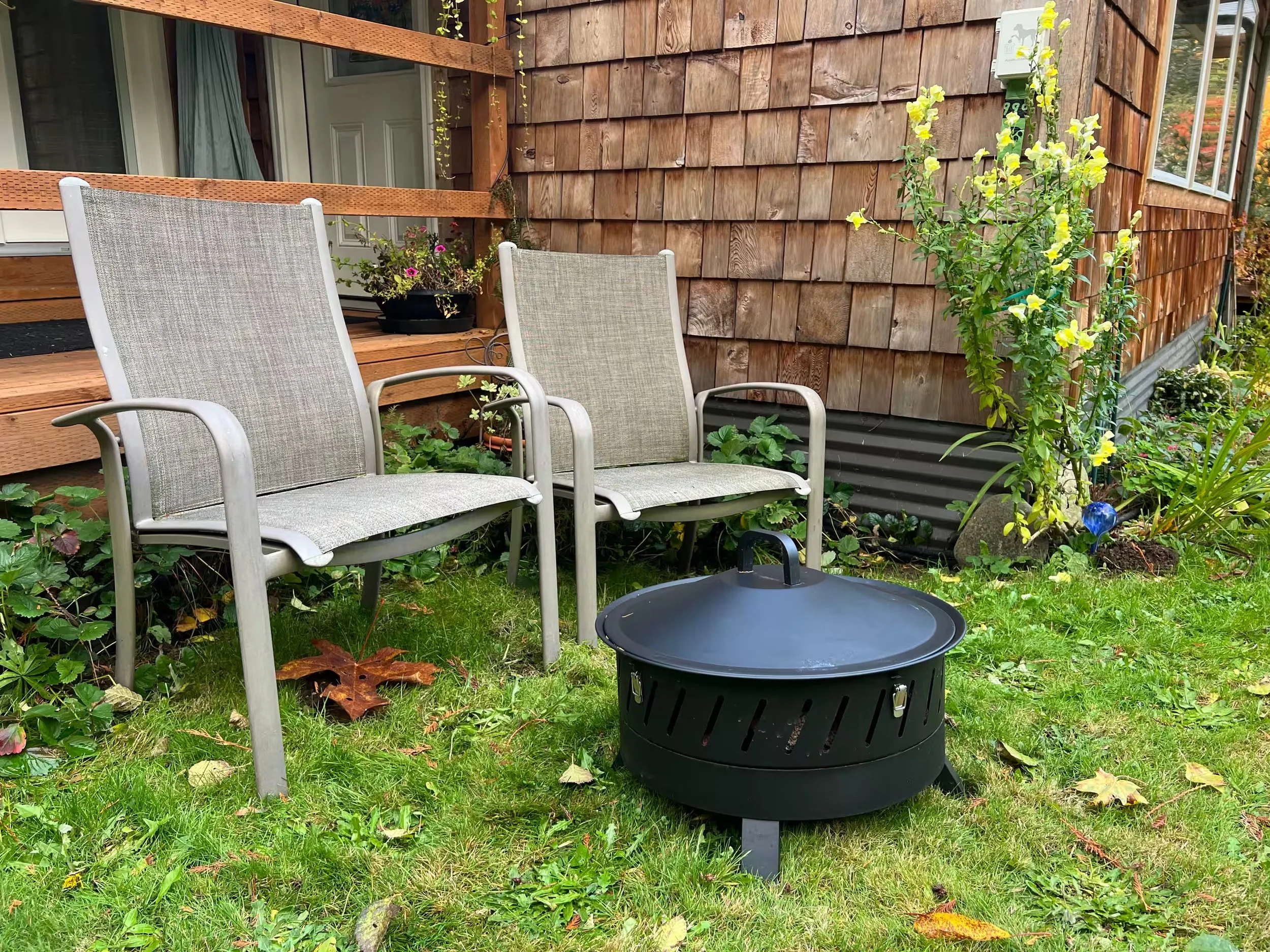 Porch-side fire pit for s'mores and stories.