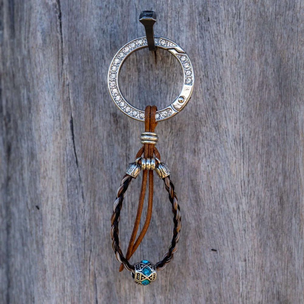 Key ring Multi colour looped with bling blue bead & ring, leather lace